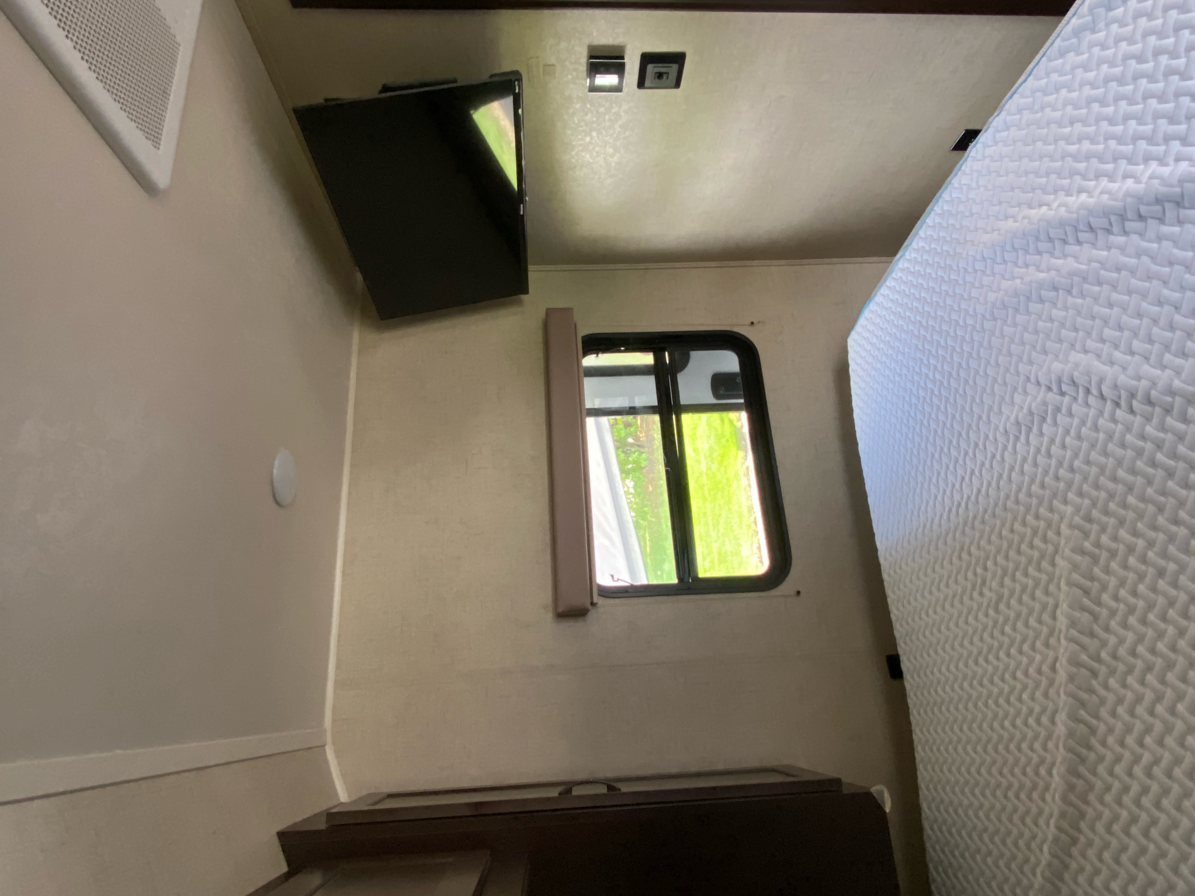 King size bed with separate AC unit and TV w/ Roku. East to West Della Terra 2019