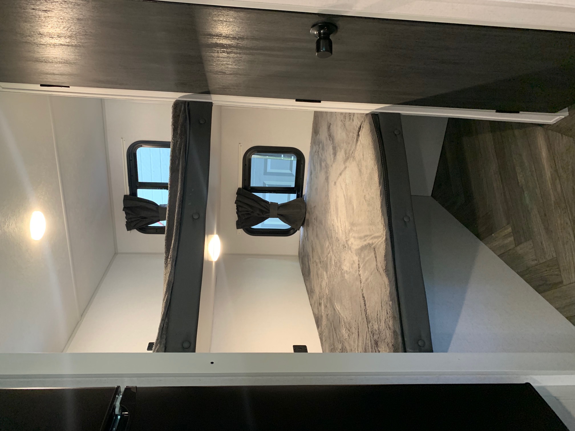 Cozy RV rental bunk beds: two modern bunks with windows, lights & grey accents. Perfect for family adventures.. Forest River Salem FSX 2021