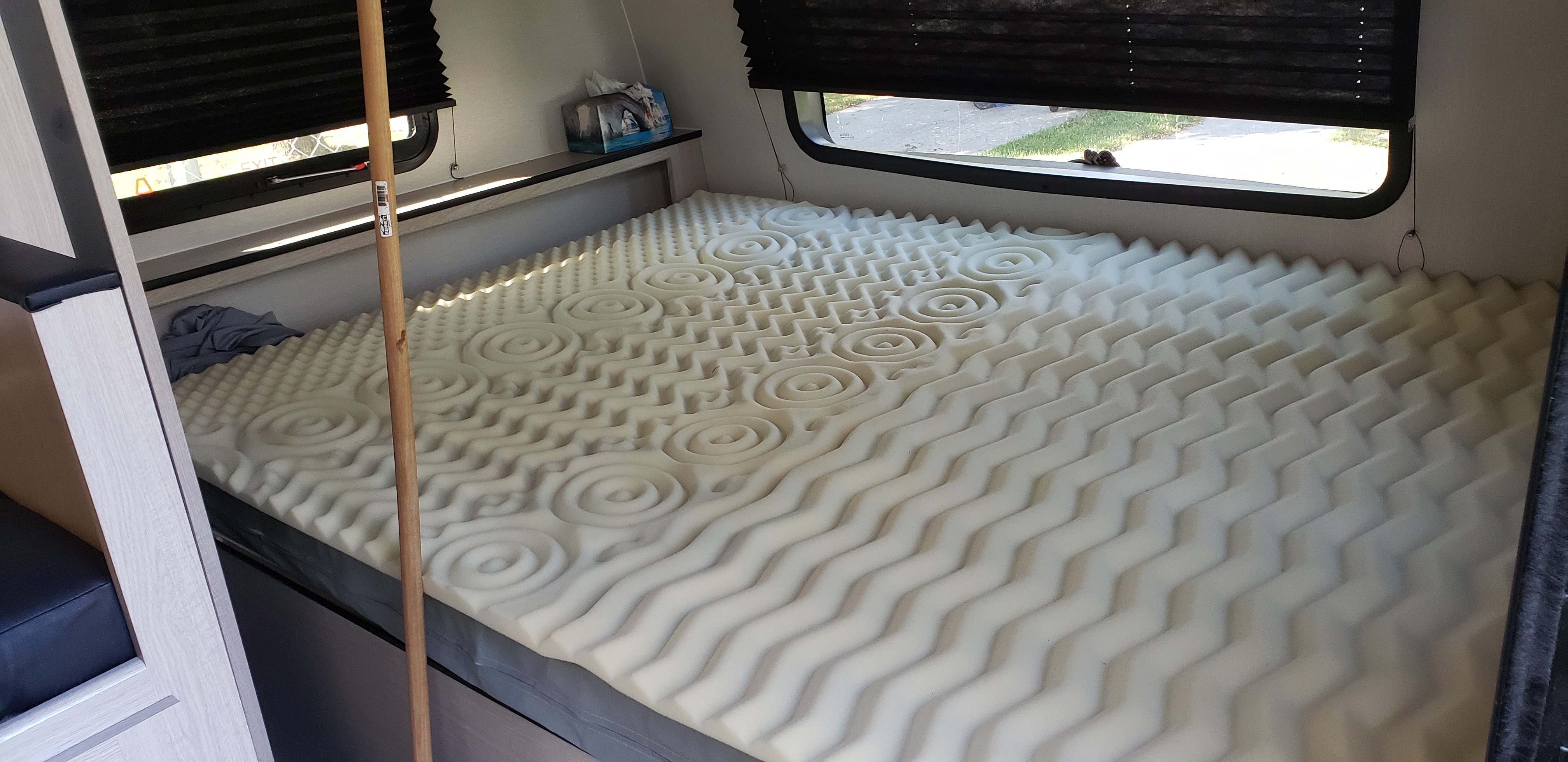 queen bed. Large cubby area at the head of the bed for phones, books, etc.. Coachmen Apex Nano 2021
