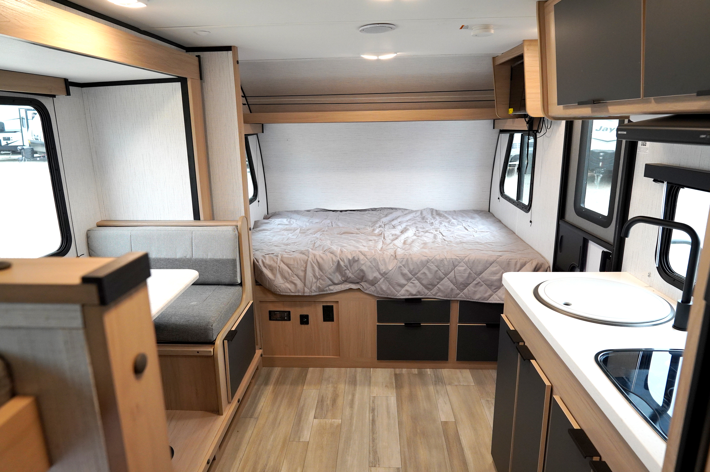 Spacious RV rental interior with a comfy bed, cozy dinette, and functional kitchen. Perfect for your next adventure.. Cruiser Rv Corp Hitch 2022