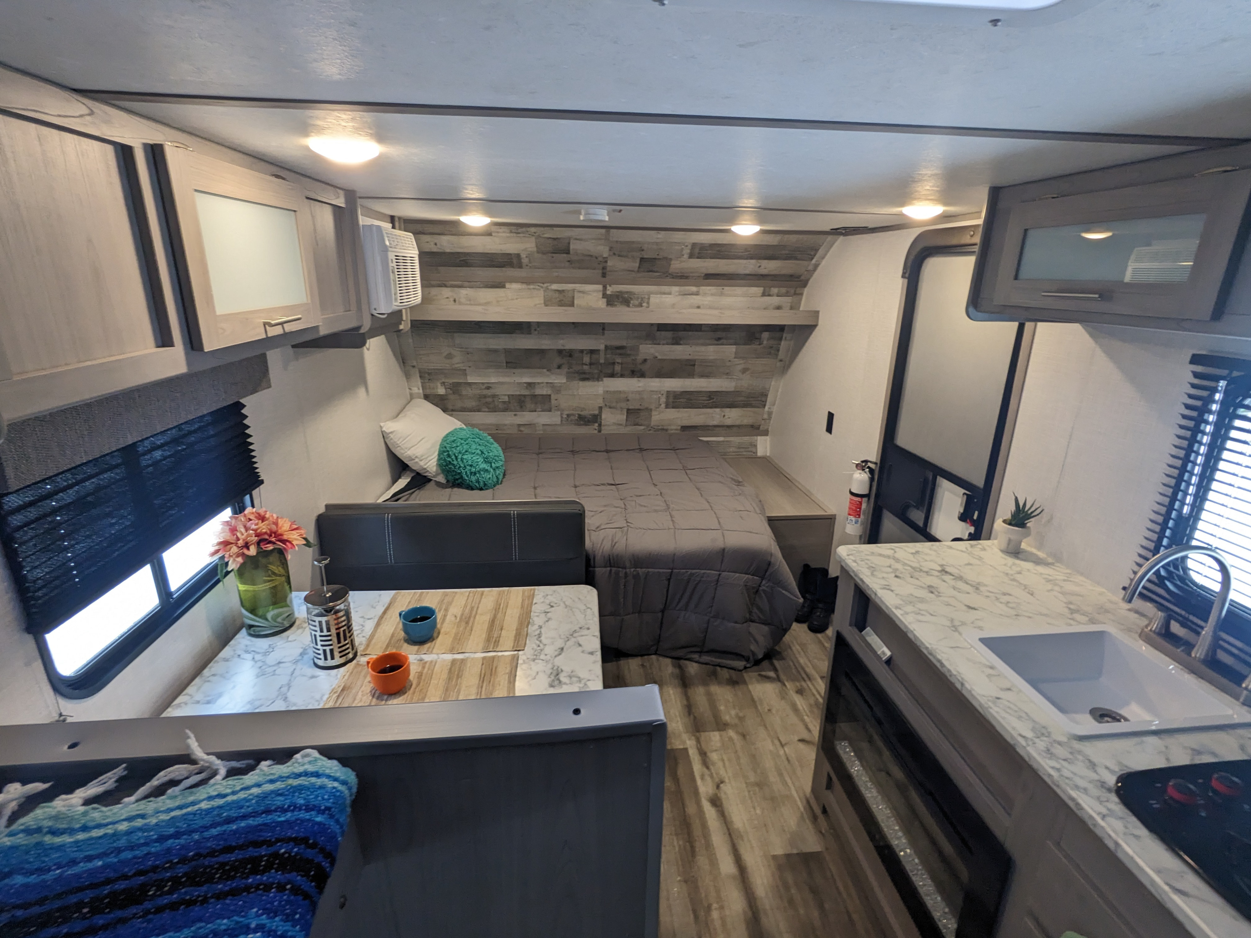 Cozy RV rental interior with bedroom, kitchen, and dining areas. Perfect for comfortable travel adventures.. Dutchmen Coleman Lantern LT 2022