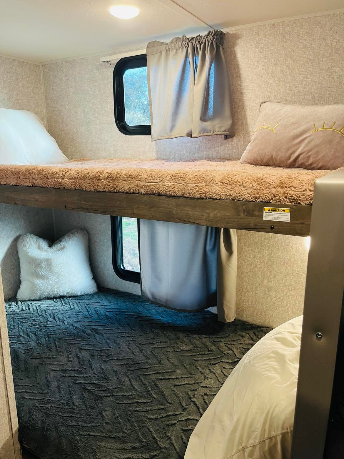 Bunkbeds with personal light and privacy curtain. Storage underneath bottom bunk. . Aspen Trail LE 2019