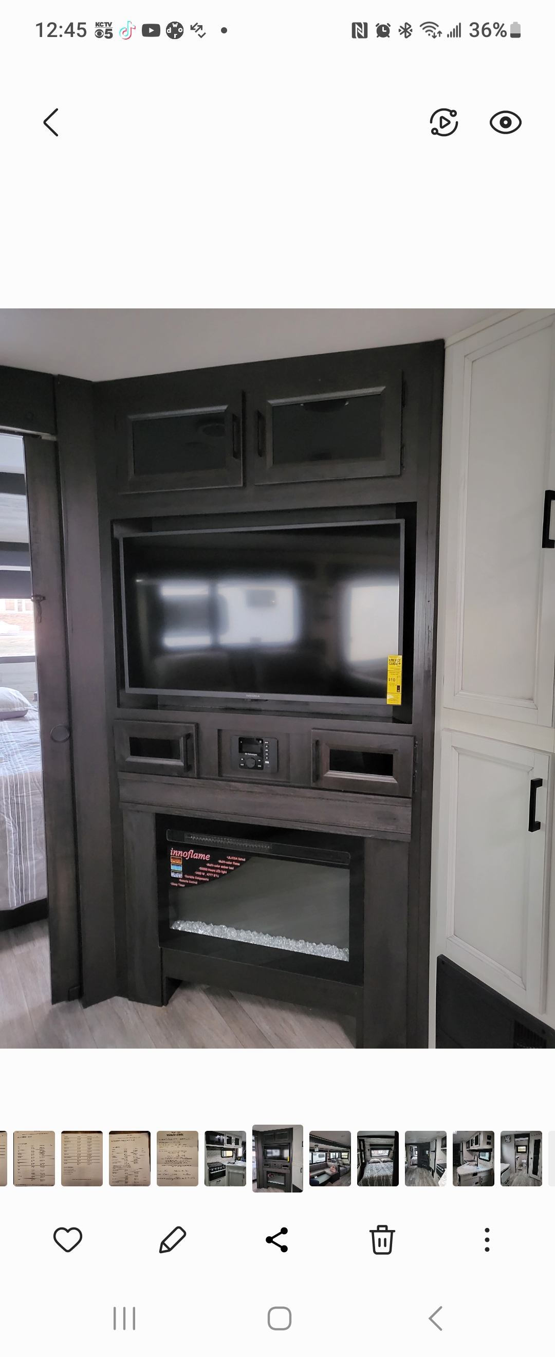 RV rental: Modern RV living area with dark wood entertainment center, TV, audio, and electric fireplace.. Jayco White Hawk 2022