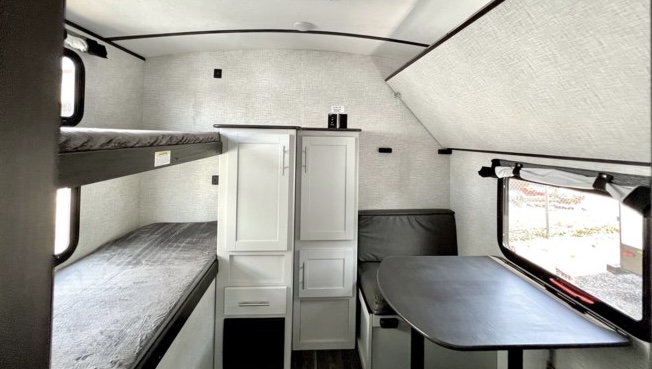 3 bunk beds and the table folds down for a 4th bed.. Keystone RV Bullet Ultra Lite 2020