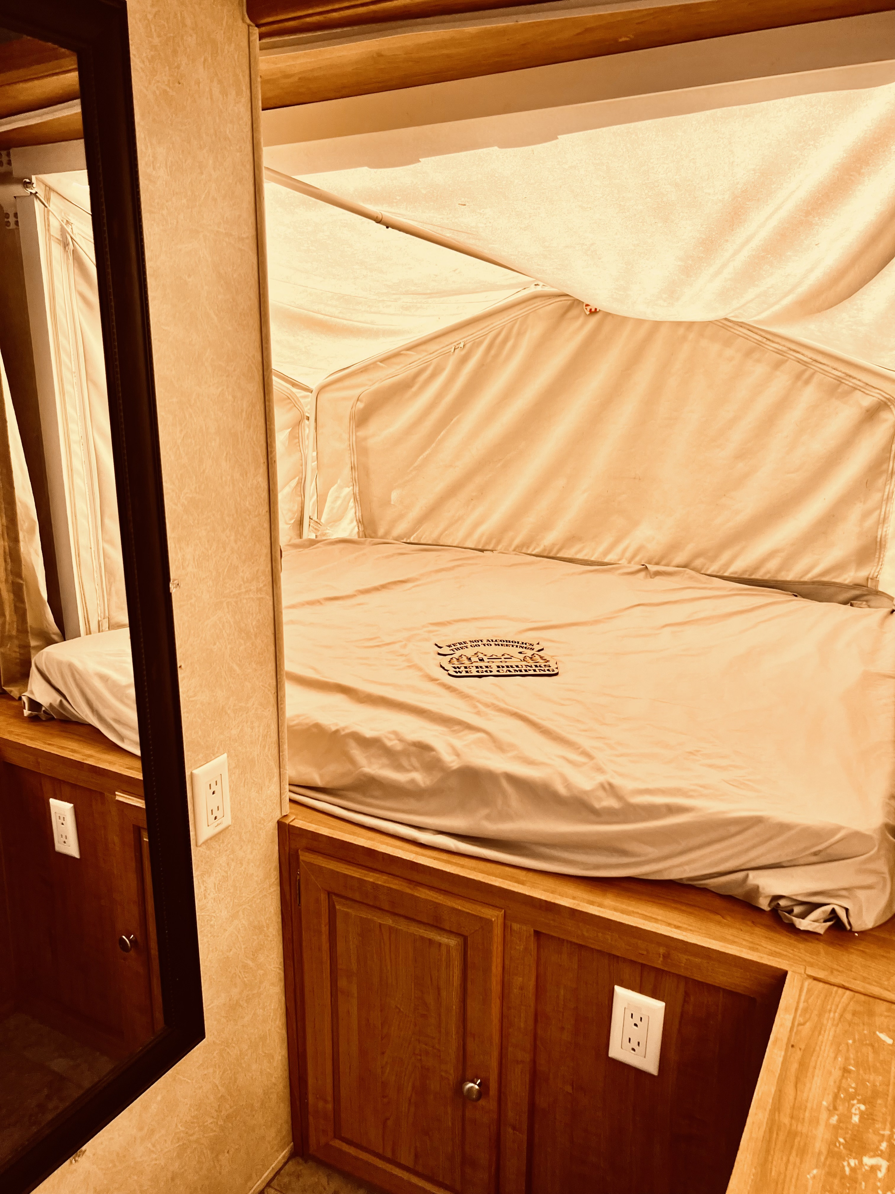 Step inside this inviting RV rental pop-up camper with a comfy bed, canvas walls, and wooden accents for your next adventure.. Forest River Flagstaff Shamrock 2009