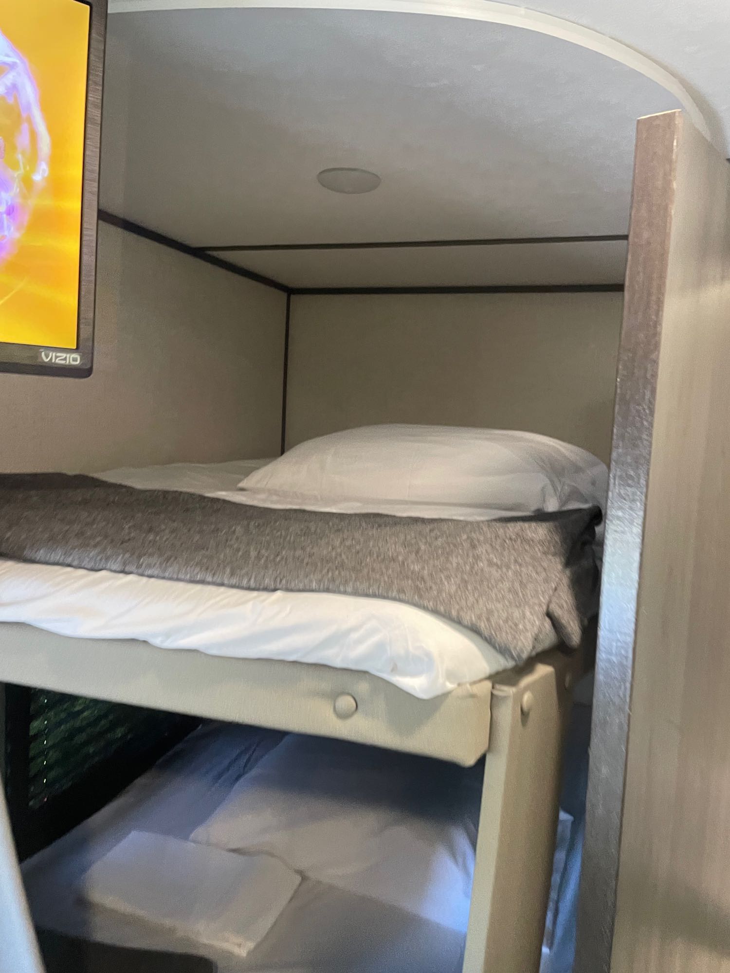 Compact RV rental bunk beds with a Vizio TV, offering cozy sleeping space for your adventures.. Dutchmen Aspen Trail 25 BH 2022