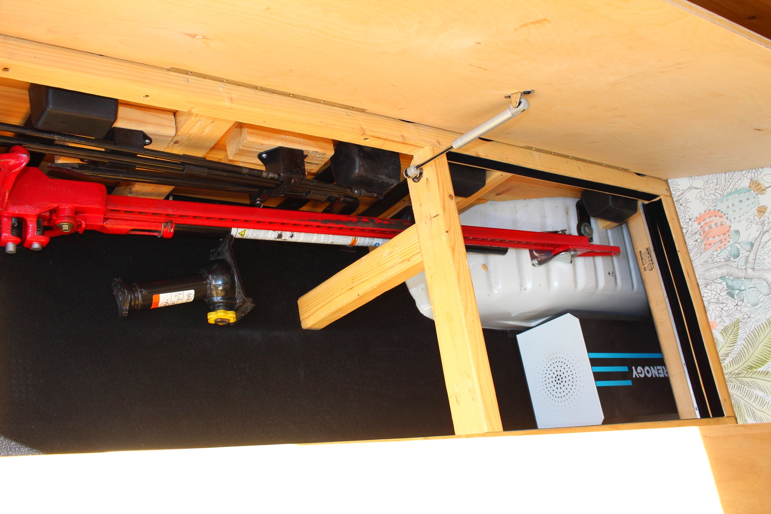 RV rental under-bed storage with a Hi-Lift jack, car jack, water tank, and Renogy power unit.. Ford Ford E350 2003