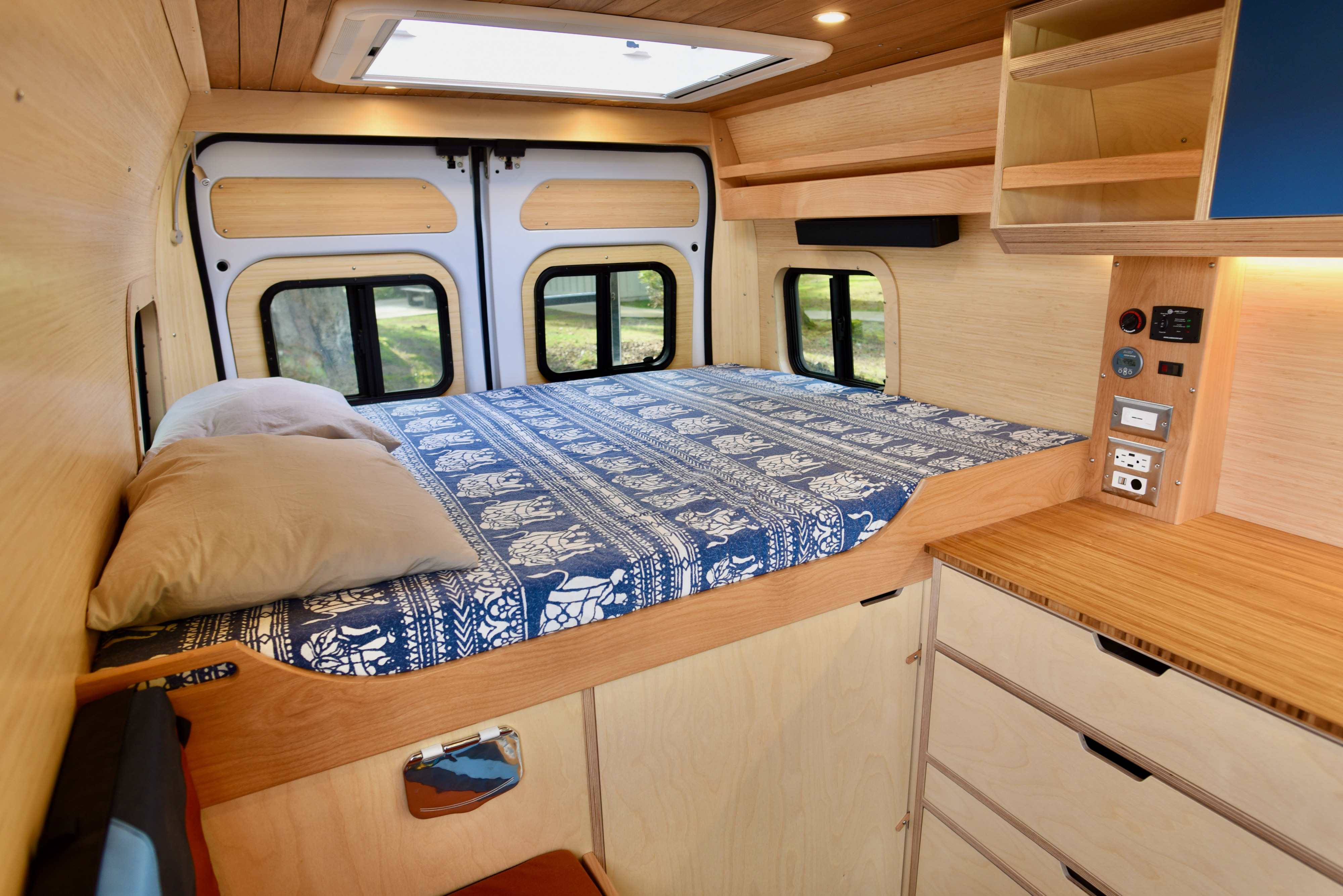 Memory foam queen short mattress, bamboo pillows (x4), down comforter, Bose sound bar and the largest camper skylight available. Ultimate stargazing.. Dodge Promaster 2021