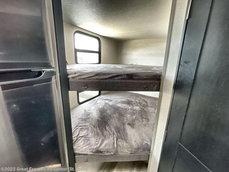 Compact RV rental interior featuring comfortable bunk beds for extra sleeping space. Ideal for family adventures.. Forest River Tracer 2022