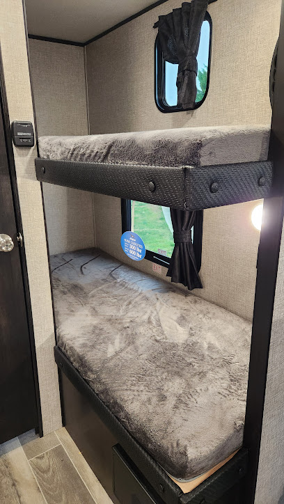 RV rental interior: two cozy bunk beds with plush gray mattresses & windows for natural light.. Jayco Jay Flight SLX STX Edition 2022