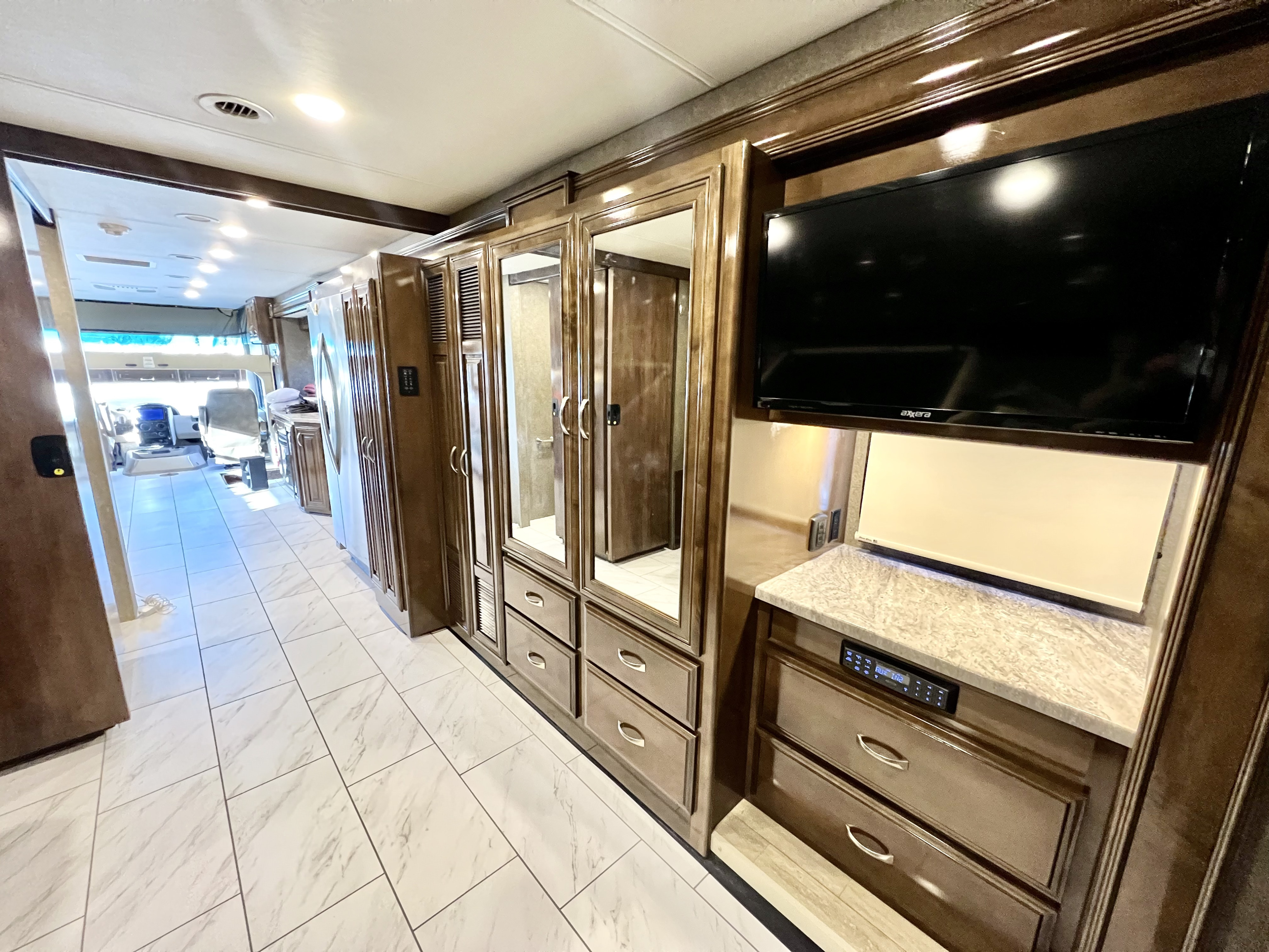 Bedroom area with TV and closet space/storage space. Thor Challenger 2018