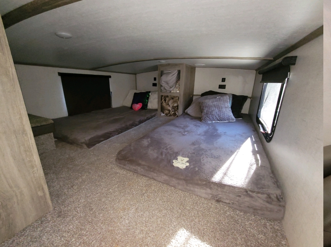RV rental's cozy bunkhouse provides multiple plush sleeping areas with soft beds for family comfort.. Forest River Salem Hemisphere 2021