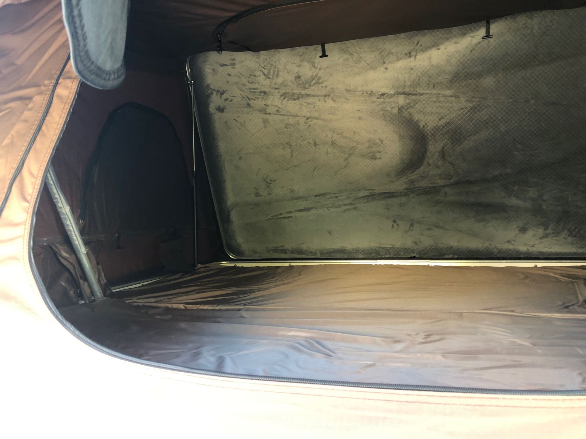 RV rental tent interior: textured gray sleeping platform and zipped side access.. Toyota Other 2008