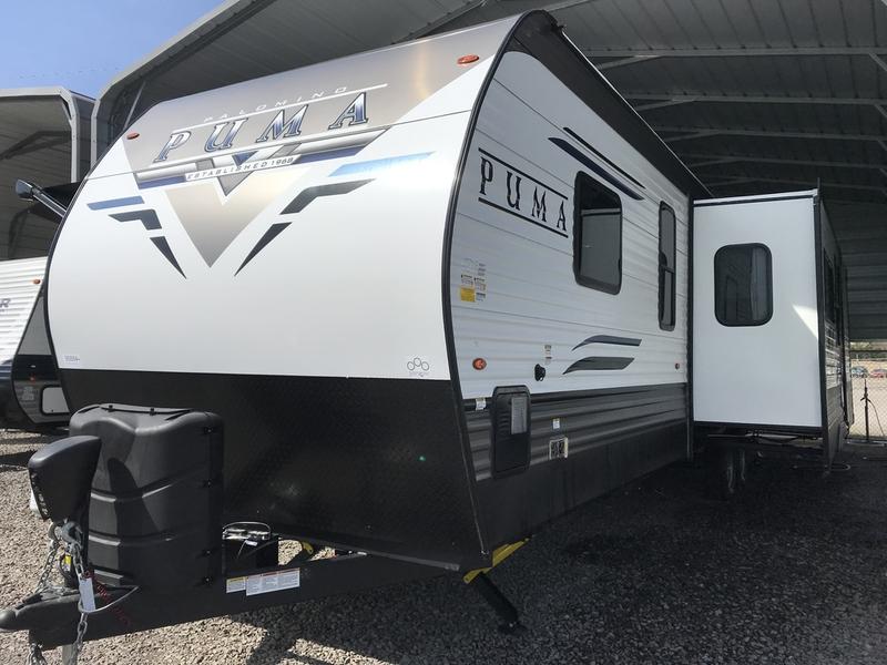 This Puma travel trailer, perfect for your next RV rental adventure, features a spacious slide-out section.. Forest River Palomino Puma 2022