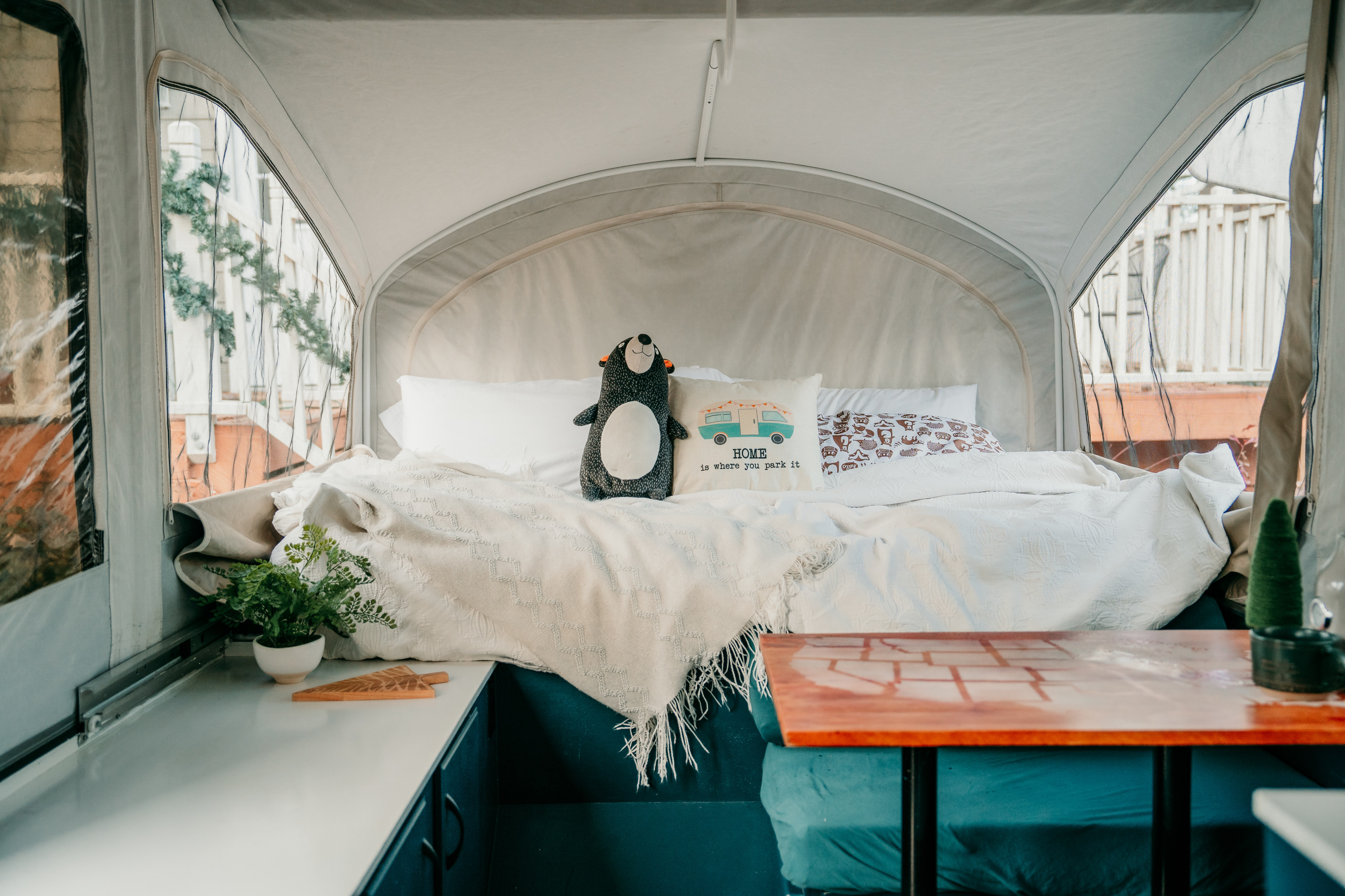 Experience comfort in this RV rental! Enjoy a cozy bed with a "HOME is where you park it" pillow and charming decor.. Jayco Jay 2015