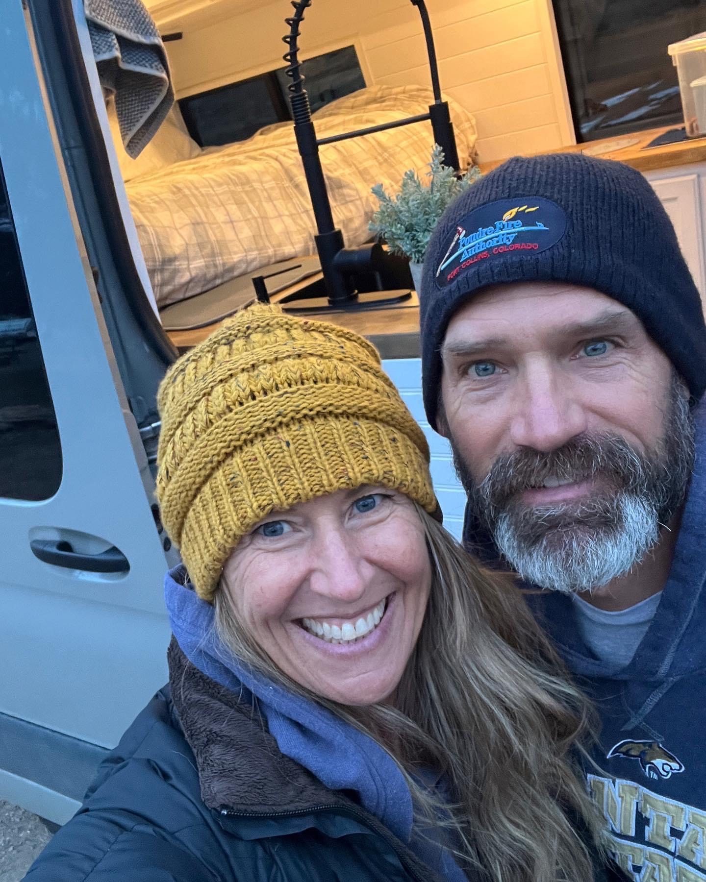 Happy couple smiles by their RV rental, a cozy camper van with a bed & kitchen. Ready for new adventures!. Mercedes-Benz Sprinter 2026