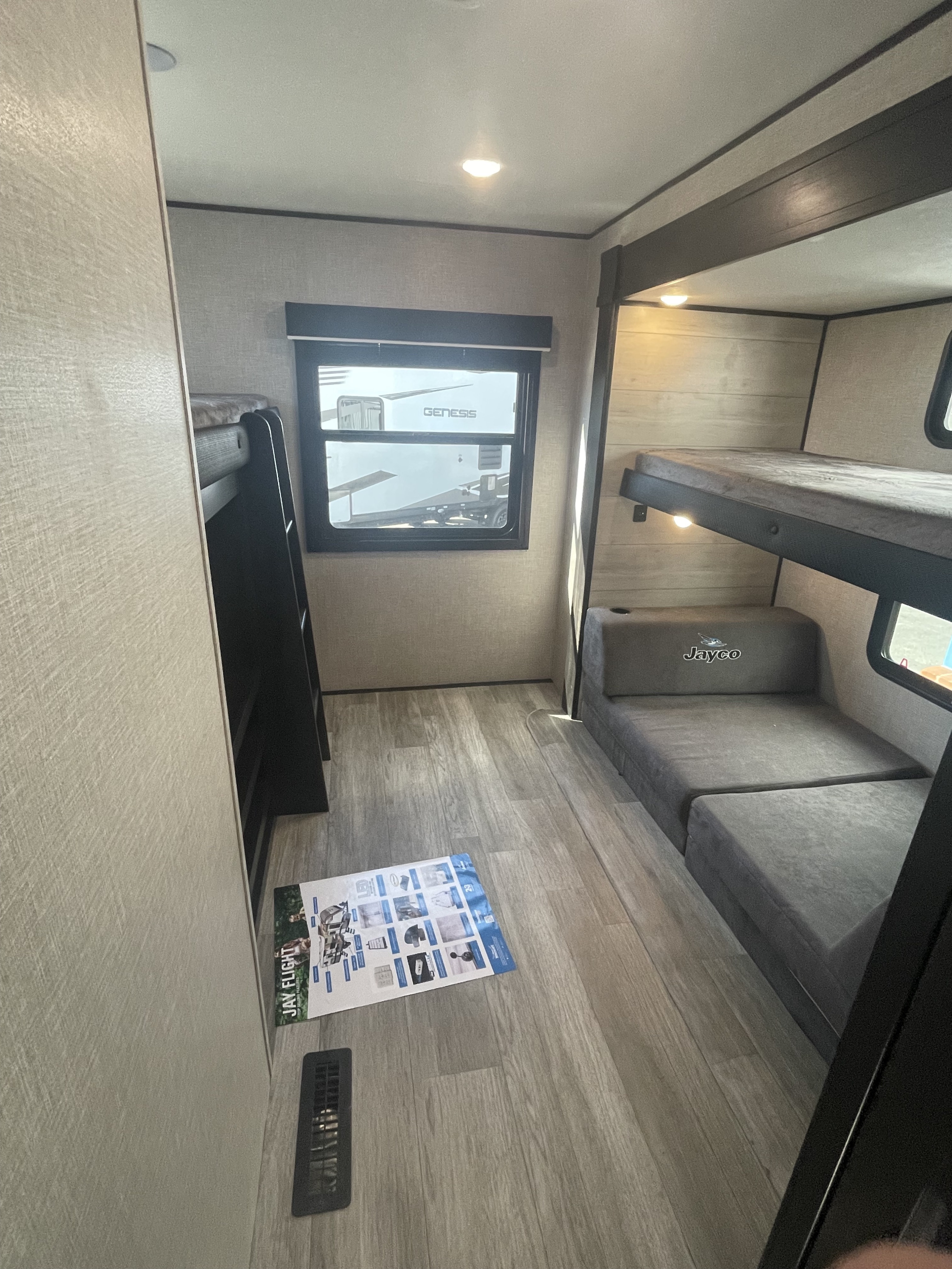 Explore this cozy RV rental bunkhouse! Features bunk beds, a Jayco convertible sofa, and durable wood-look flooring.. Jayco JayFlight 2023