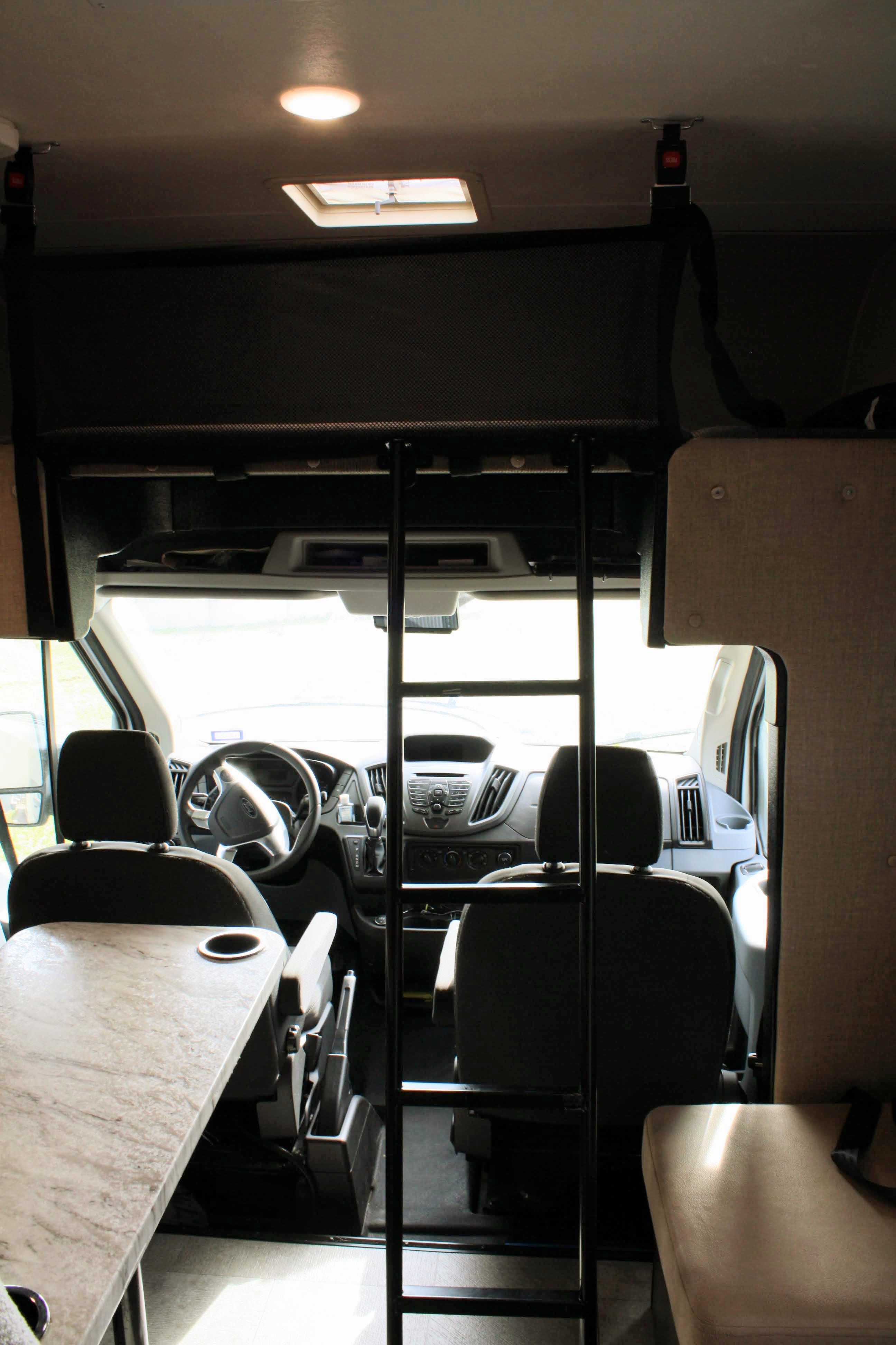 Over cab sleeping with safety net. I wouldn't recommend sleeping up here as an adult as it more built for kids.. Forest River Coachmen Freelander Micro 2018