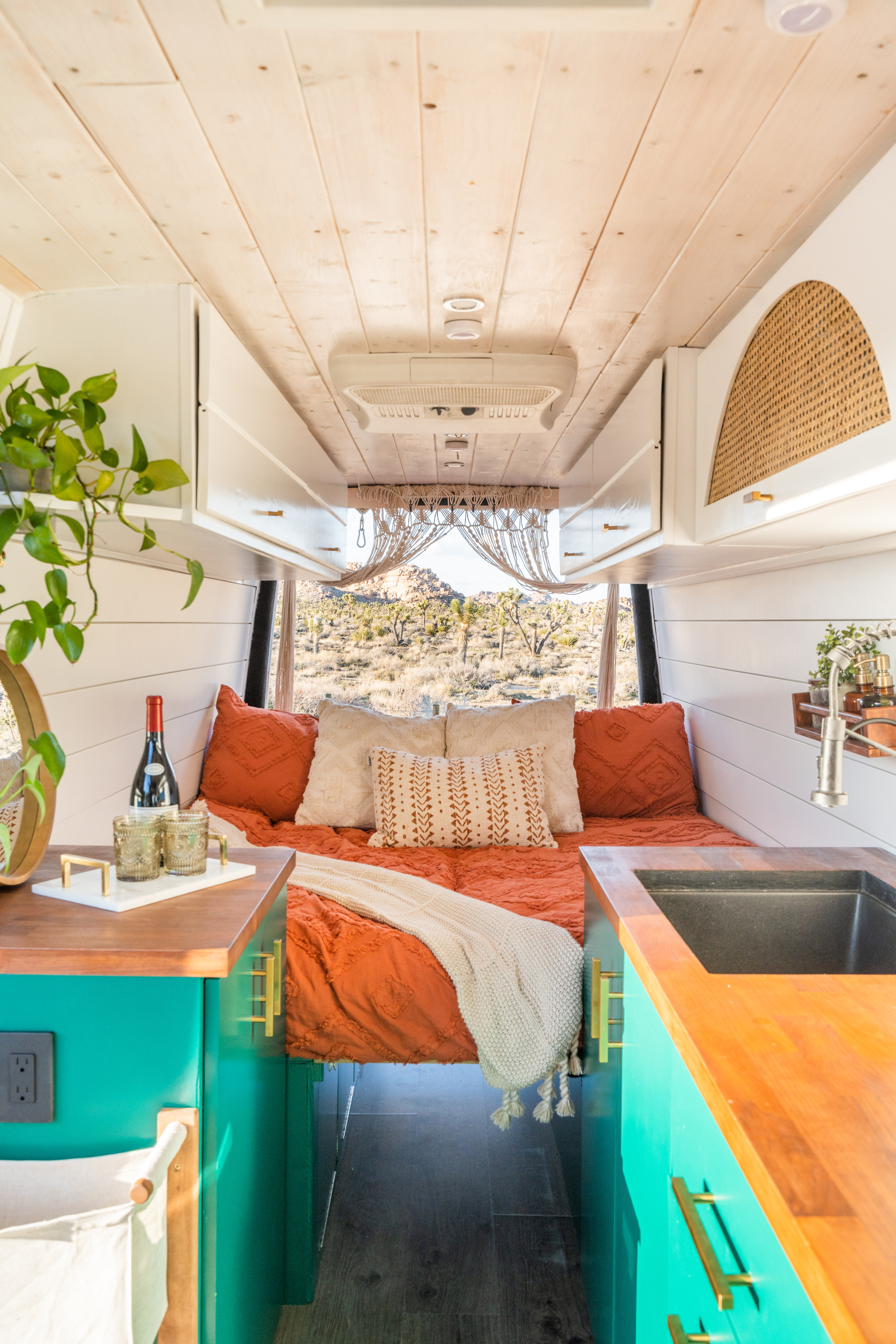 King sized bed. Nature’s head toilet discreetly installed in cabinet opposite of sink.. Mercedes-Benz Sprinter 2010