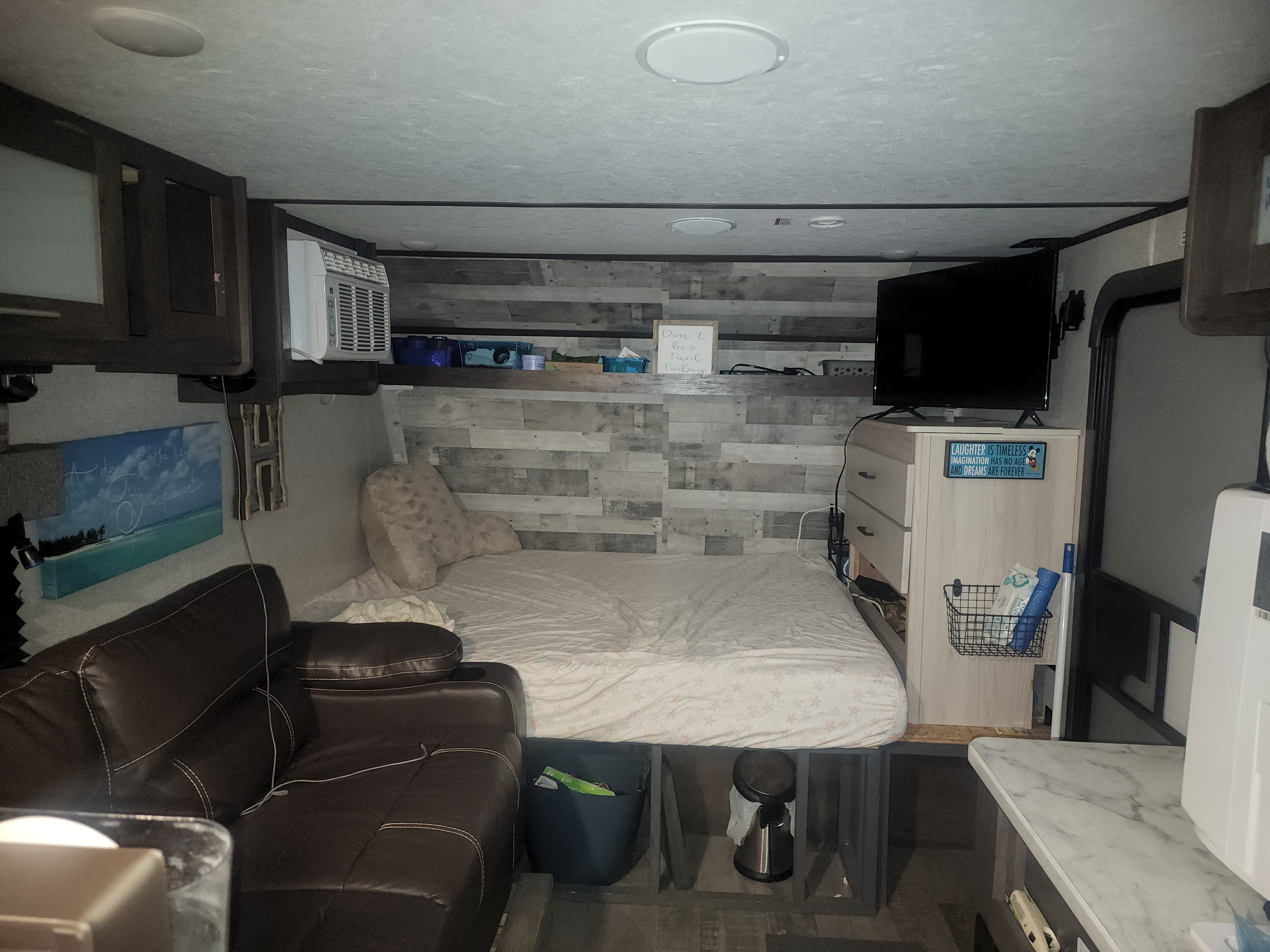 Queen memory foam mattress.  Baskets for storage under bed.  Dog water dispenser and food storage under dresser at foot of bed.. Dutchmen Coleman Lantern LT 2021