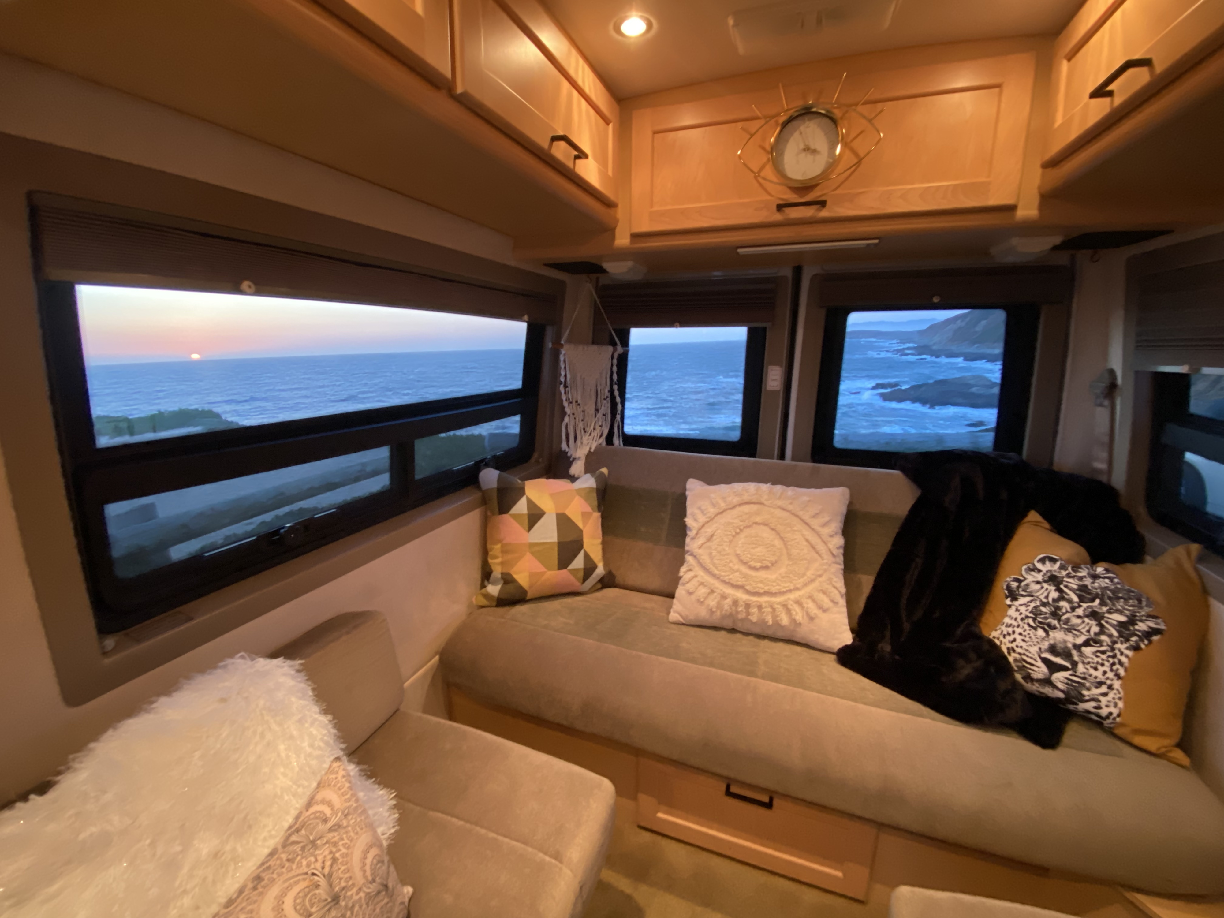 Relax in this cozy RV rental's interior, boasting panoramic ocean views, a sunset, & stylish decor.. Sprinter Diesel Pleasure-Way Pleasure Way Class B 2005