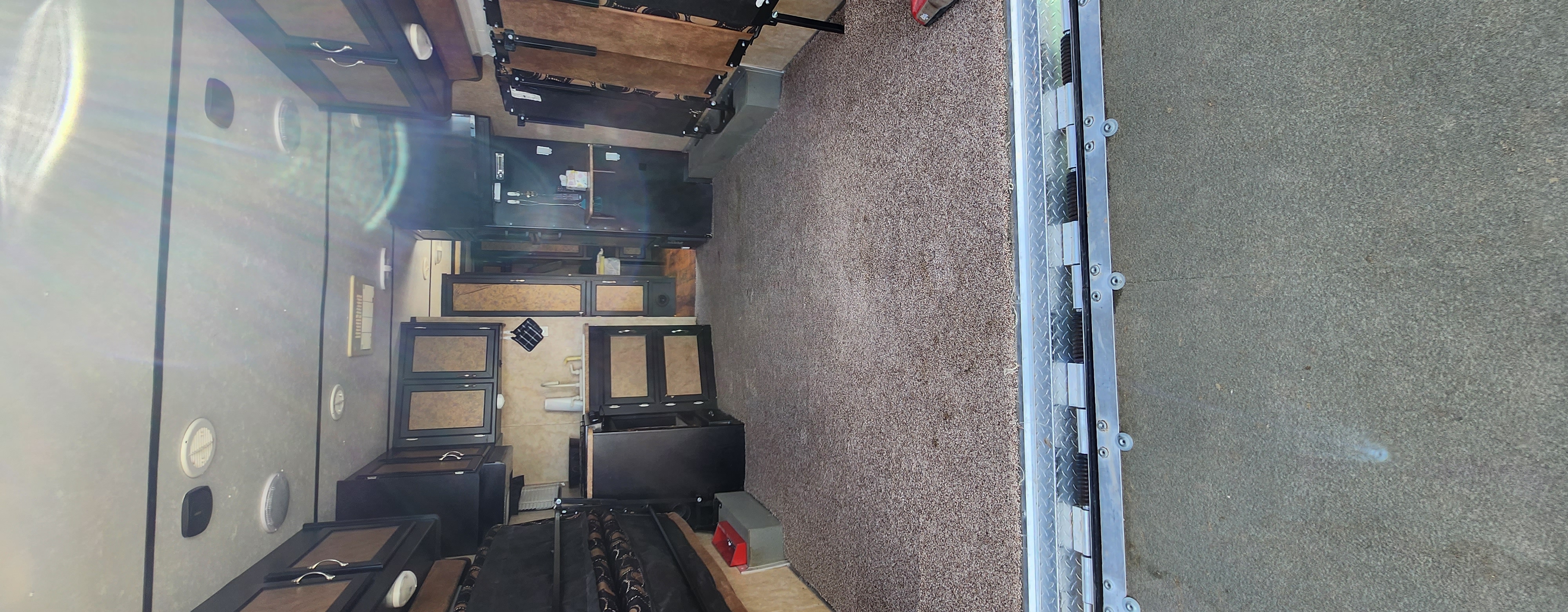 Inside this versatile RV rental: carpeted floors, built-in cabinetry, and bunk beds, offering comfortable mobile living.. Forest River Work And Play 2013