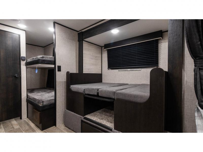 RV rental: Spacious bunkhouse with two bunk beds and a convertible dinette bed. Modern interior design.. Jayco Jay Flight SLX 2022