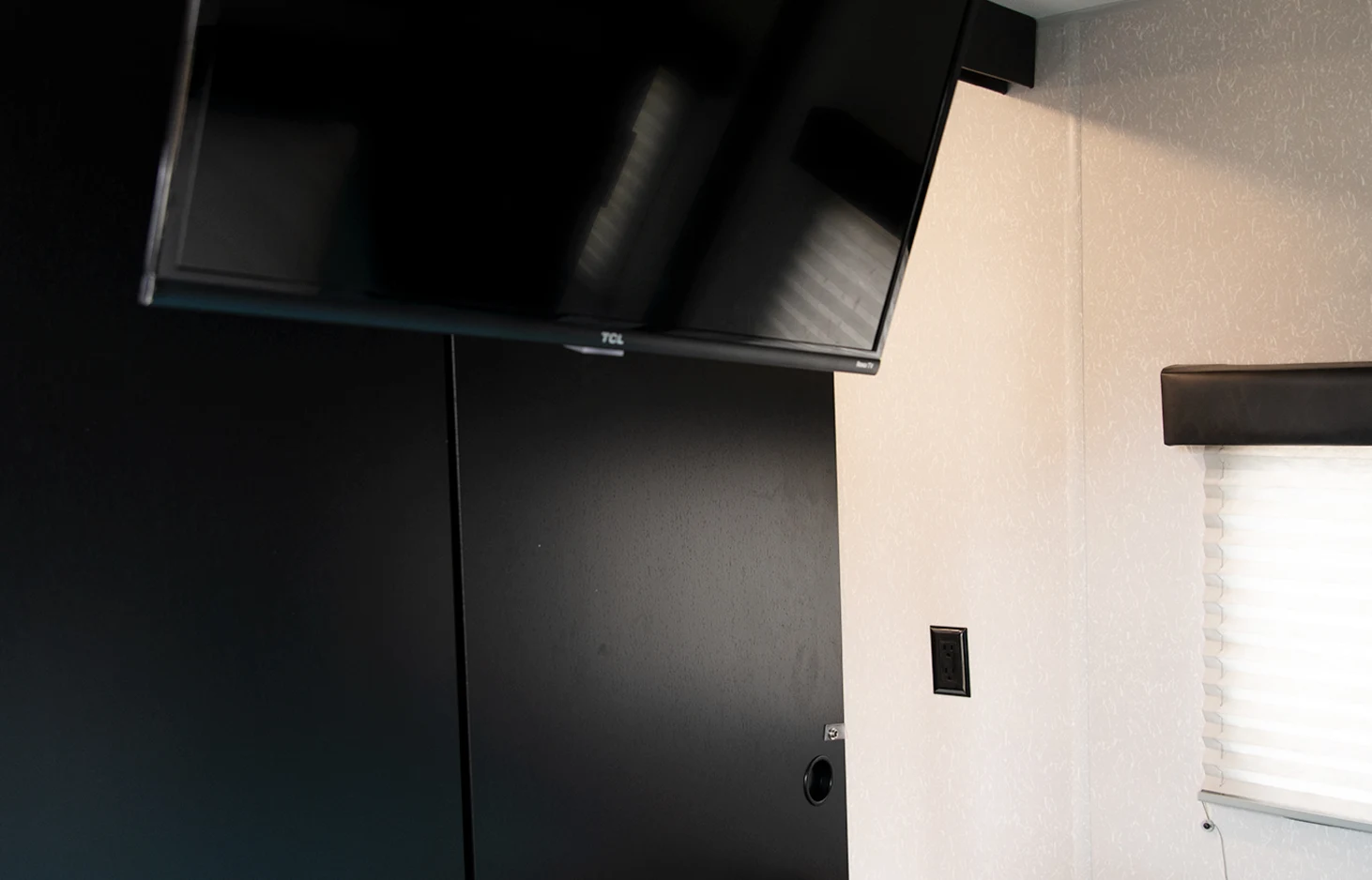 Smart TV in master bedroom. Forest River Cherokee Grey Wolf 2022