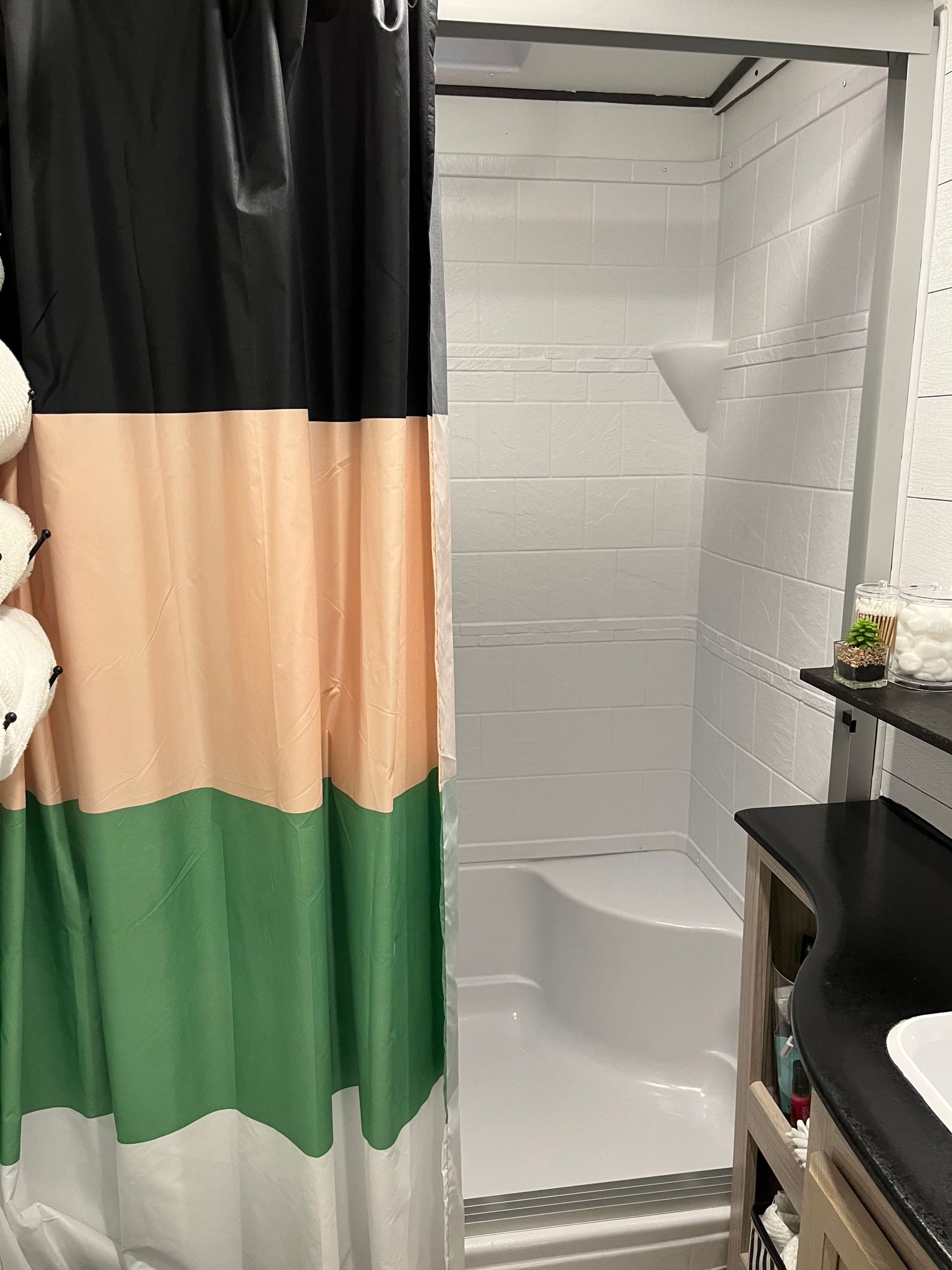 Full size shower with a fixed curtain detail to add some color and privacy. Coachmen Spirit Ultra Light 2021