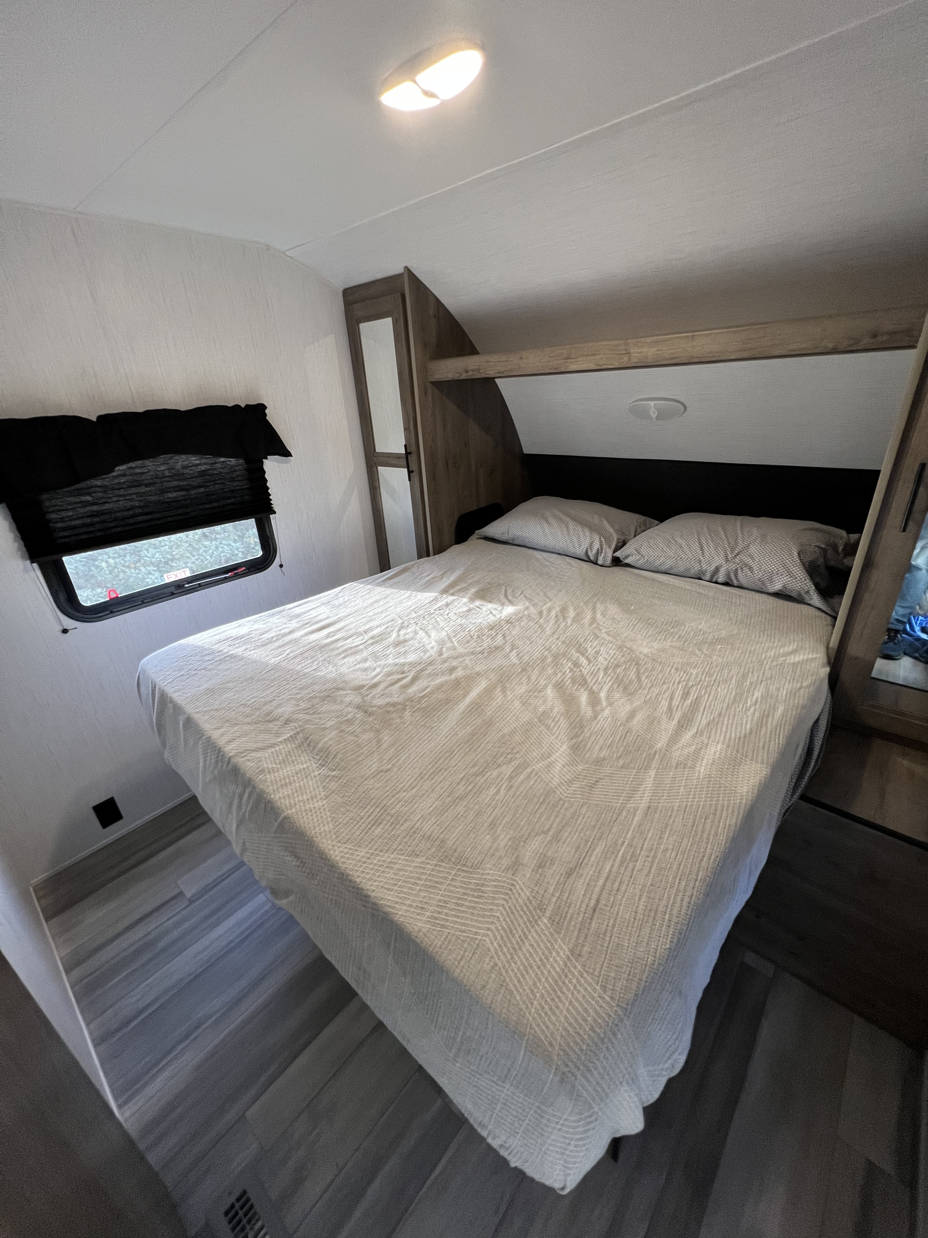 Queen memory foam mattress with double closet and storage underneath! . Heartland RVs Pioneer 2023