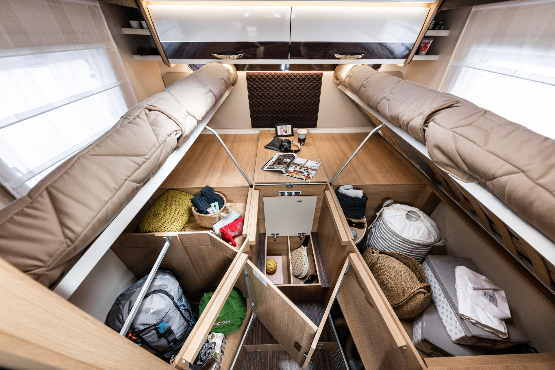 Maximize space in your rv rental! This clever RV interior features cozy bunk beds & abundant under-bed storage for all your gear.. Elnagh Baron 565 2023