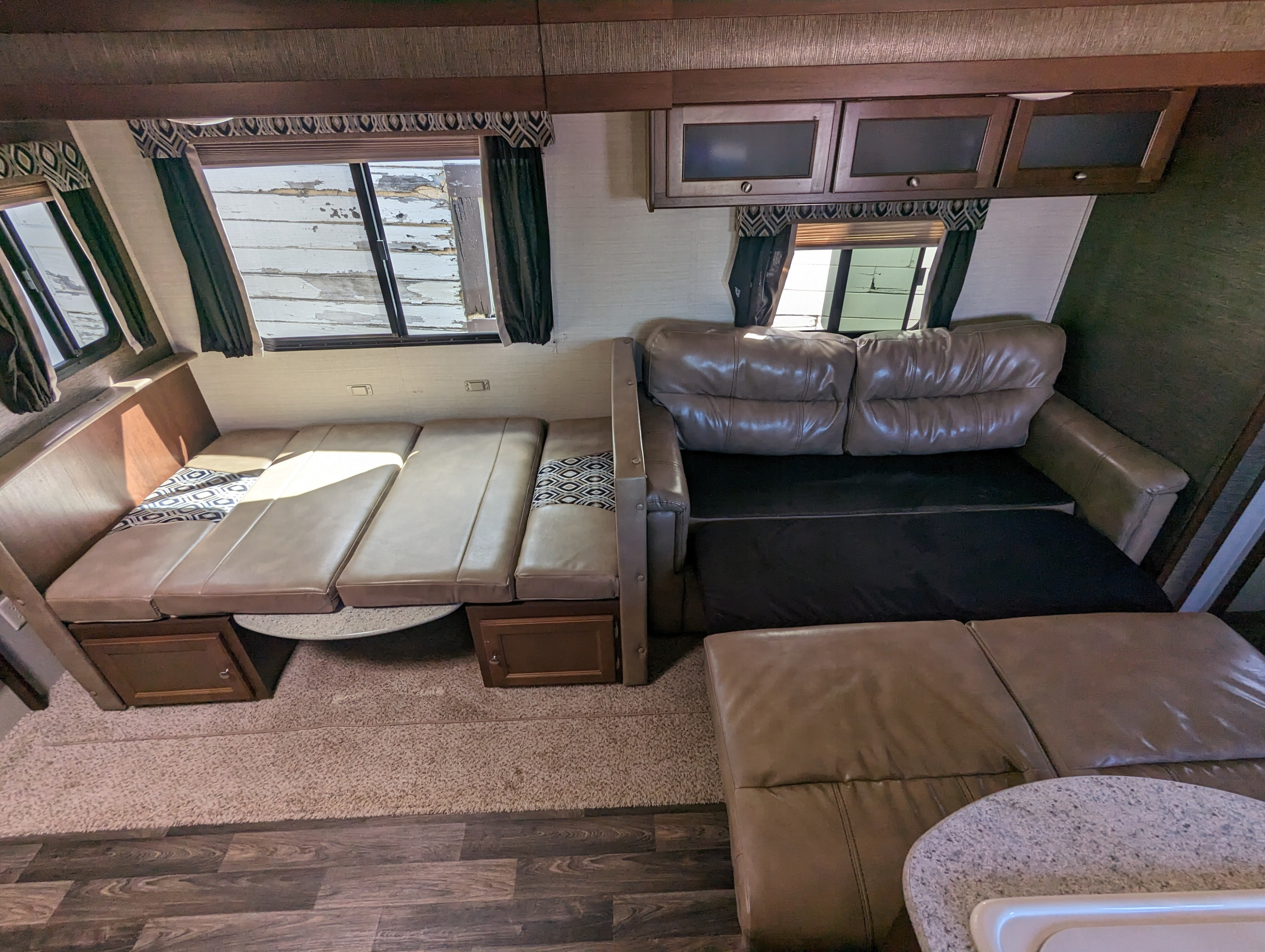 Dinette and sofa converted for sleeping.. Keystone RV Bullet Ultra Lite 2016