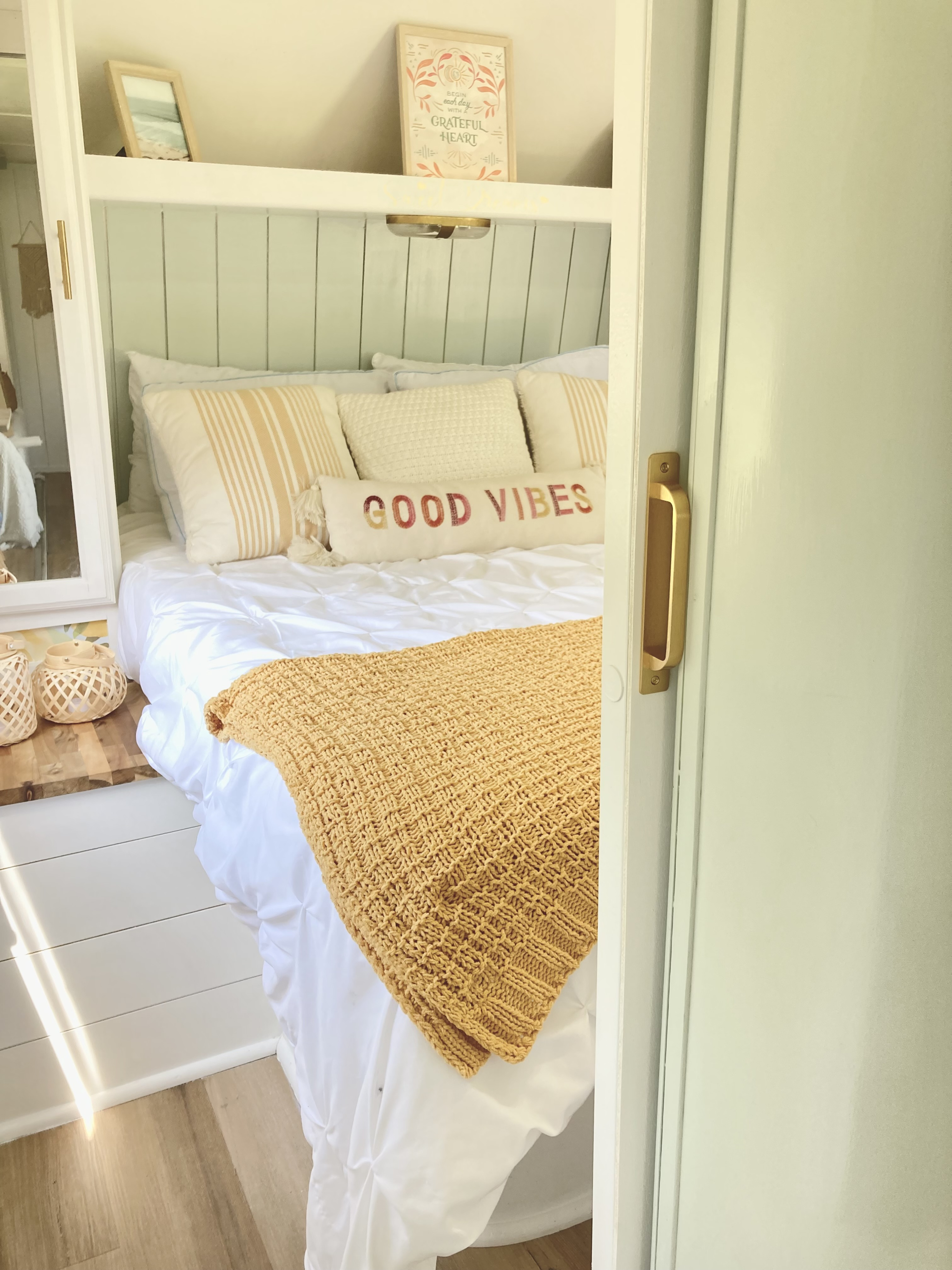 Cozy RV rental bedroom with white bedding, "GOOD VIBES" pillow, and grateful heart decor. A comfy retreat!. Other Other 2013