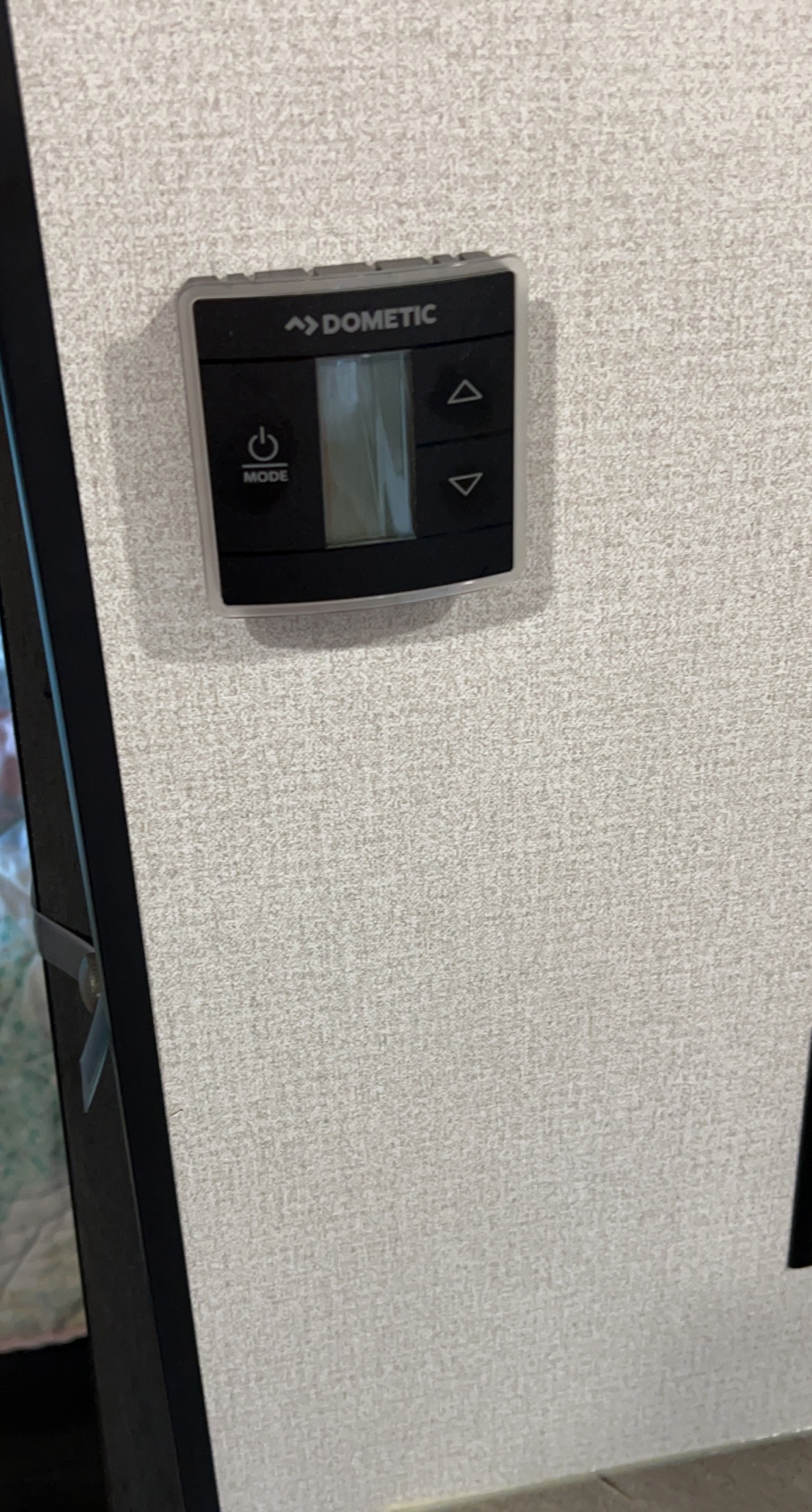 RV rental Dometic climate control unit on a textured wall. Features power, mode, and temperature adjustment buttons.. Keystone RV Hideout 2022
