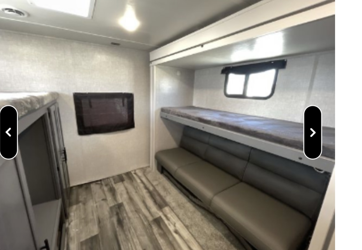 RV rental bunkhouse featuring comfortable bunk beds and a sofa seating area, ideal for family adventures.. Crossroads RV Volante 2021