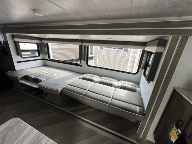 Spacious RV rental interior with convertible sofa/dinette and large windows, perfect for comfortable travel.. Salem Cruise Lite 263BHXL 2022