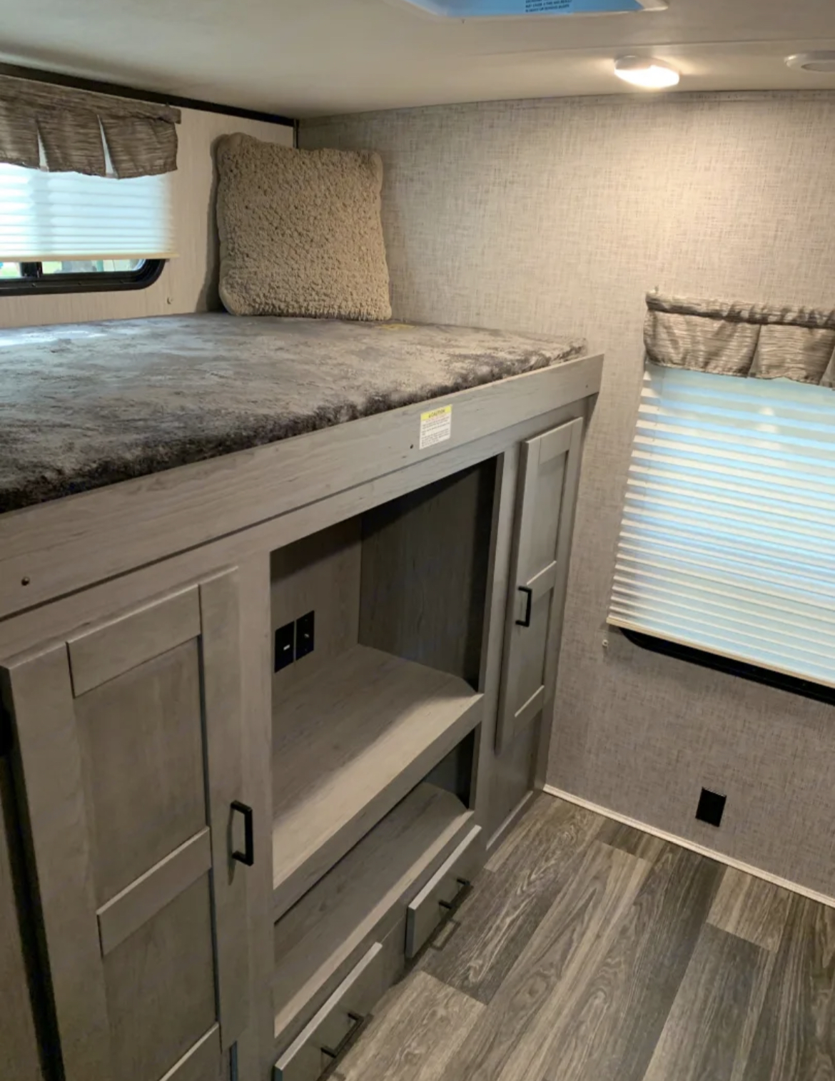 Cozy RV rental interior with bunk beds, plush bedding, and built-in storage. Ideal for a family camper trip.. Heartland RVs Mallard 2021