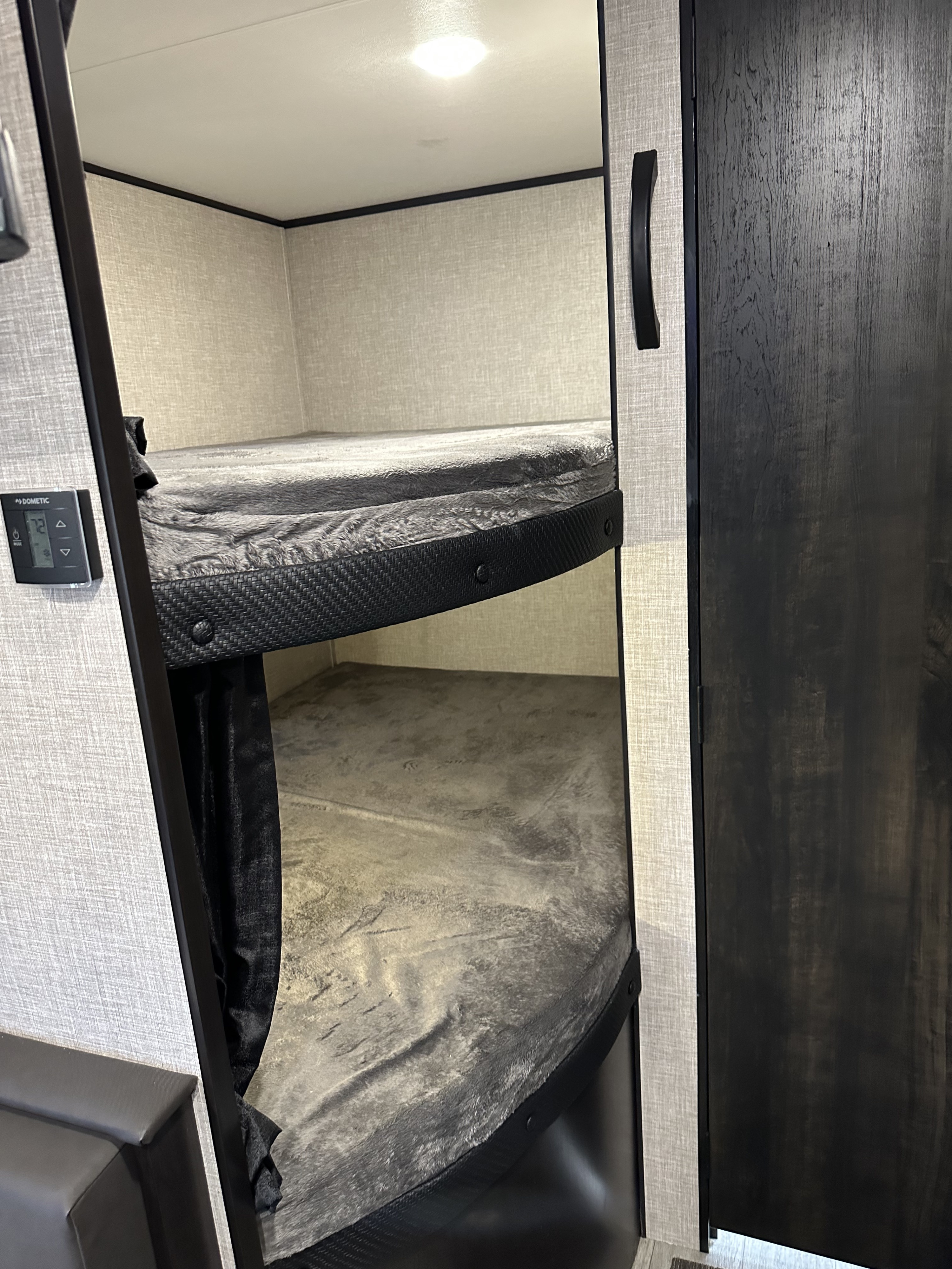 Step into this RV rental's cozy bunk area featuring two beds & Dometic climate control for comfortable adventures.. Jayco Jay Flight SLX 2022