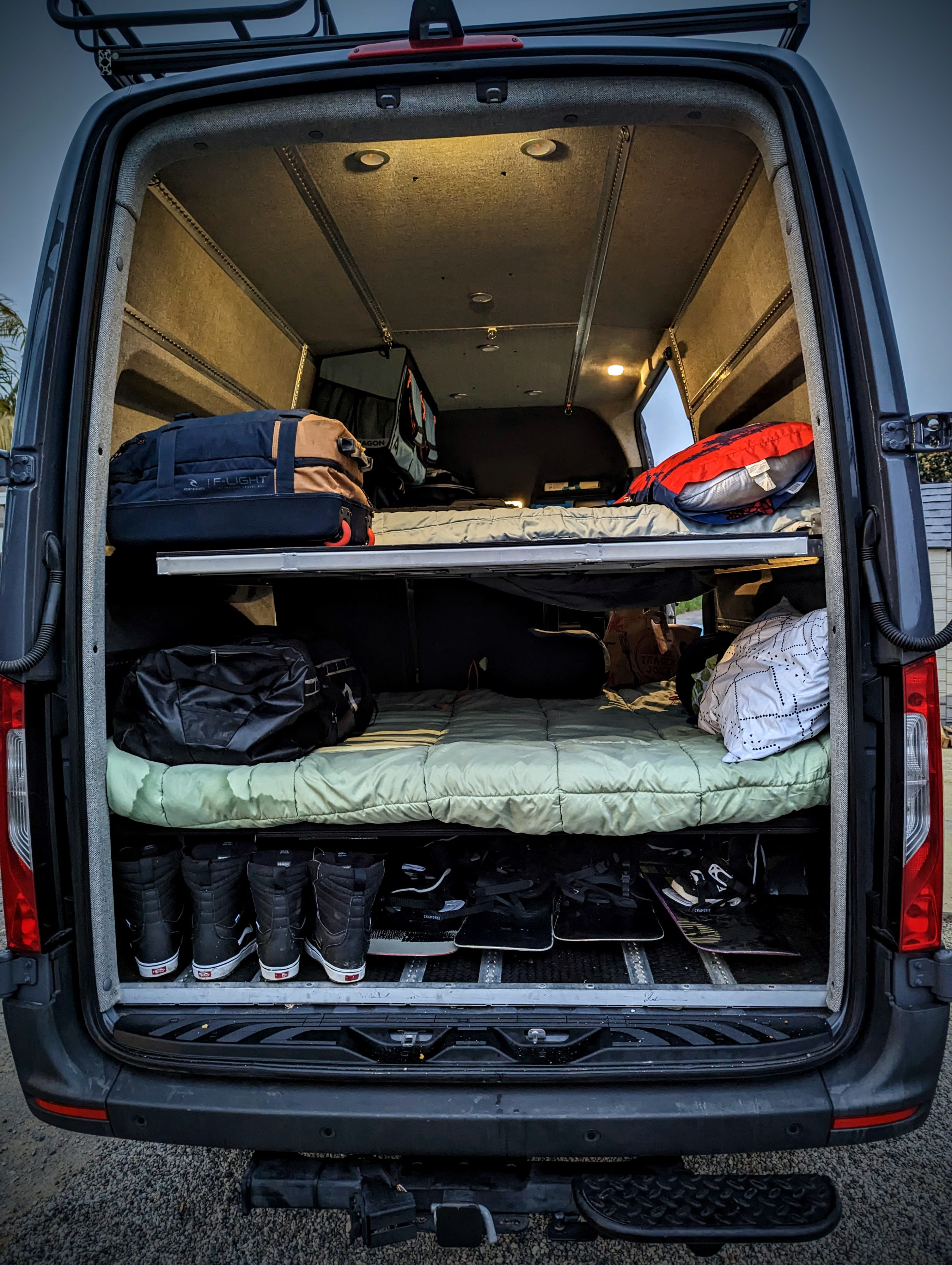 RV rental van interior: organized bunk beds, ample gear storage for snowboards & boots. Ready for adventure travel.. Mercedes-Benz sprinter 2021