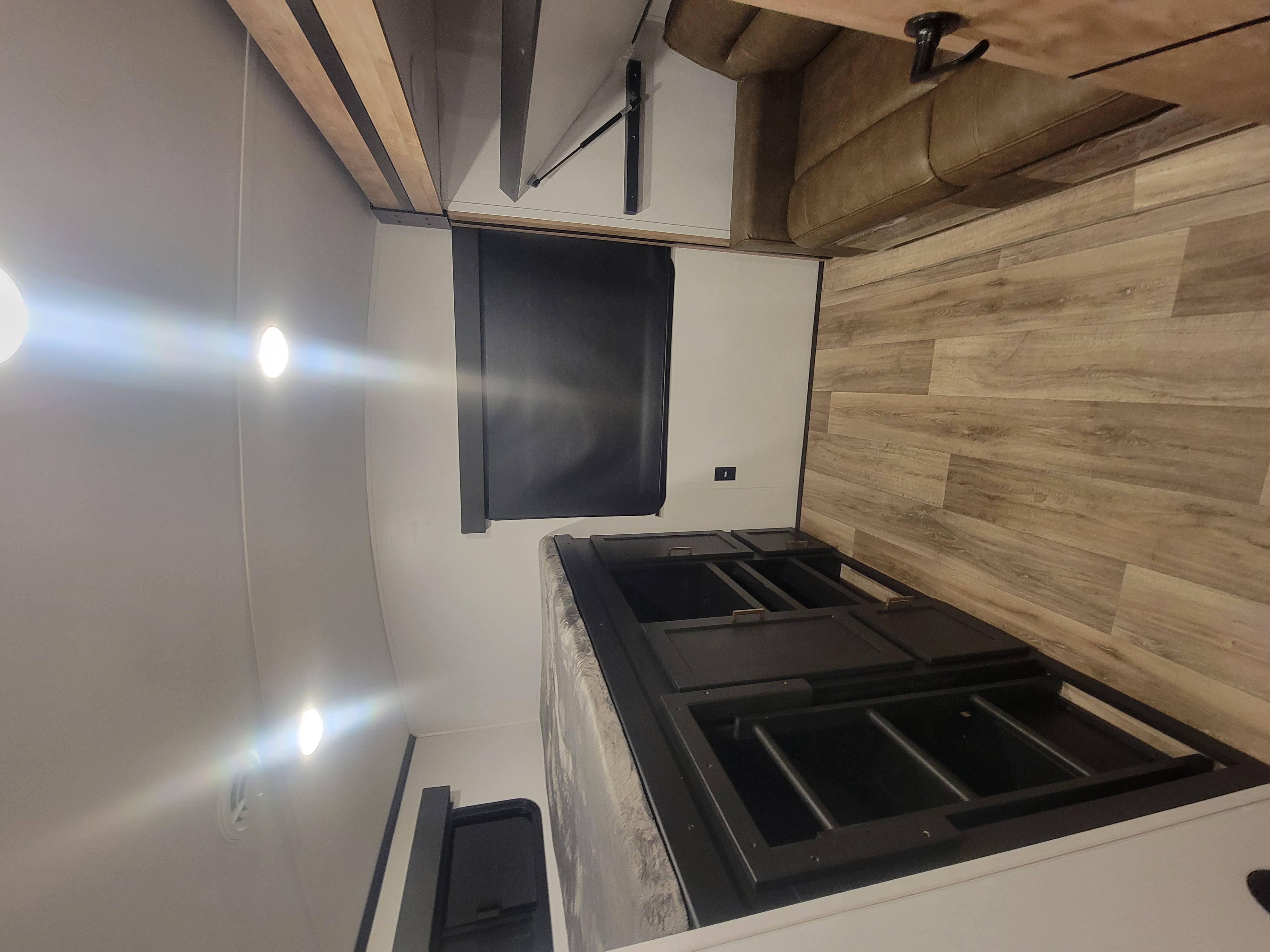 Rotated image of an RV rental's bedroom.. Keystone RV Outback 2022