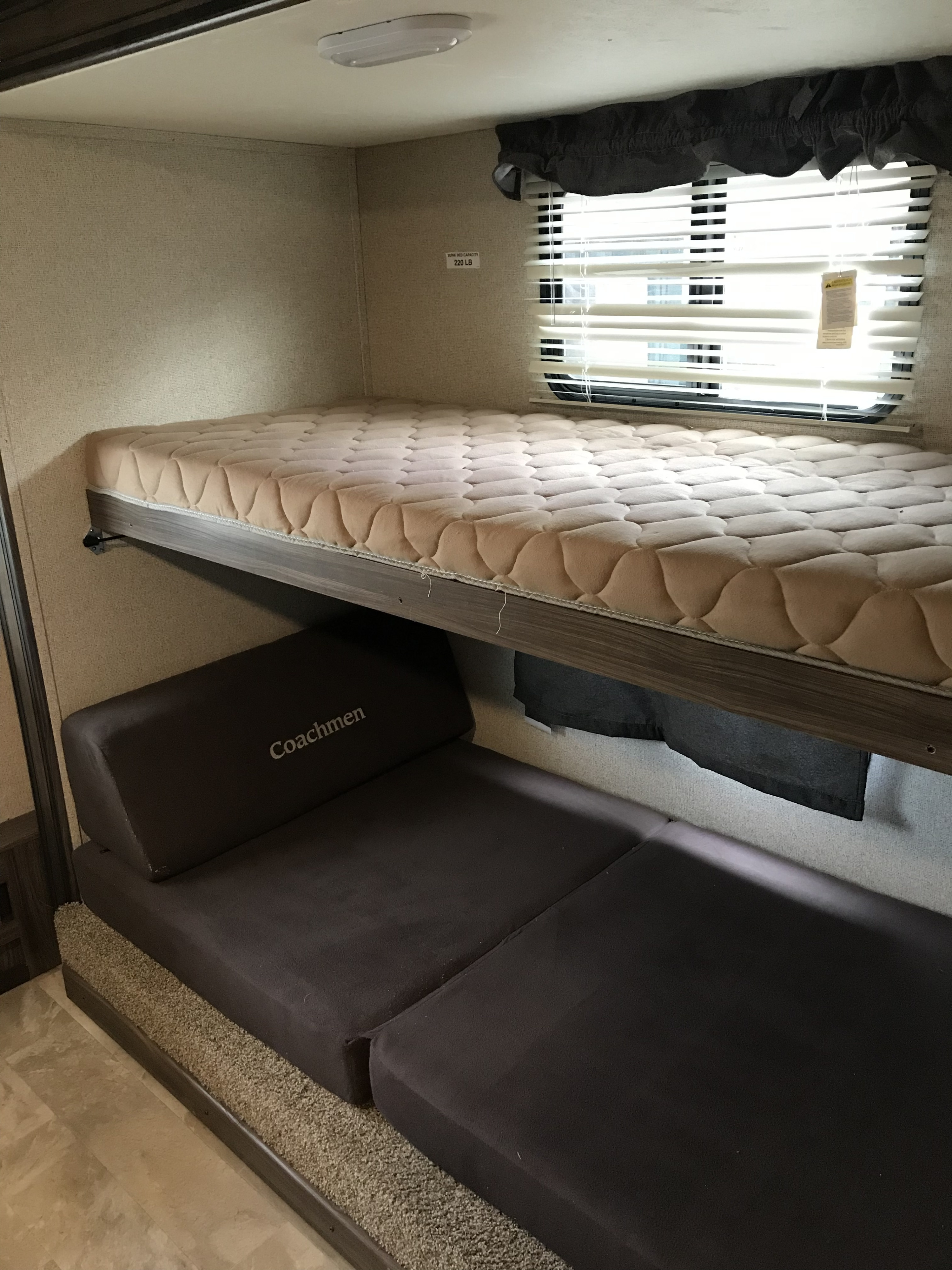 RV rental interior: Upper bunk bed & lower Coachmen convertible sofa/bed for comfortable sleeping.. Coachmen Apex 2018