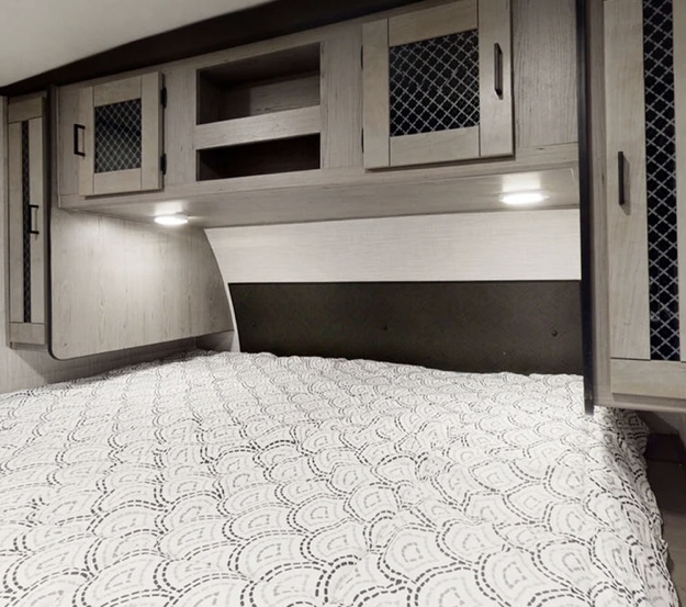 Master bedroom has plenty of storage and plush KING sized bed. Under bed storage available at foot of bed for shoes. . Heartland RVs Mallard 2021