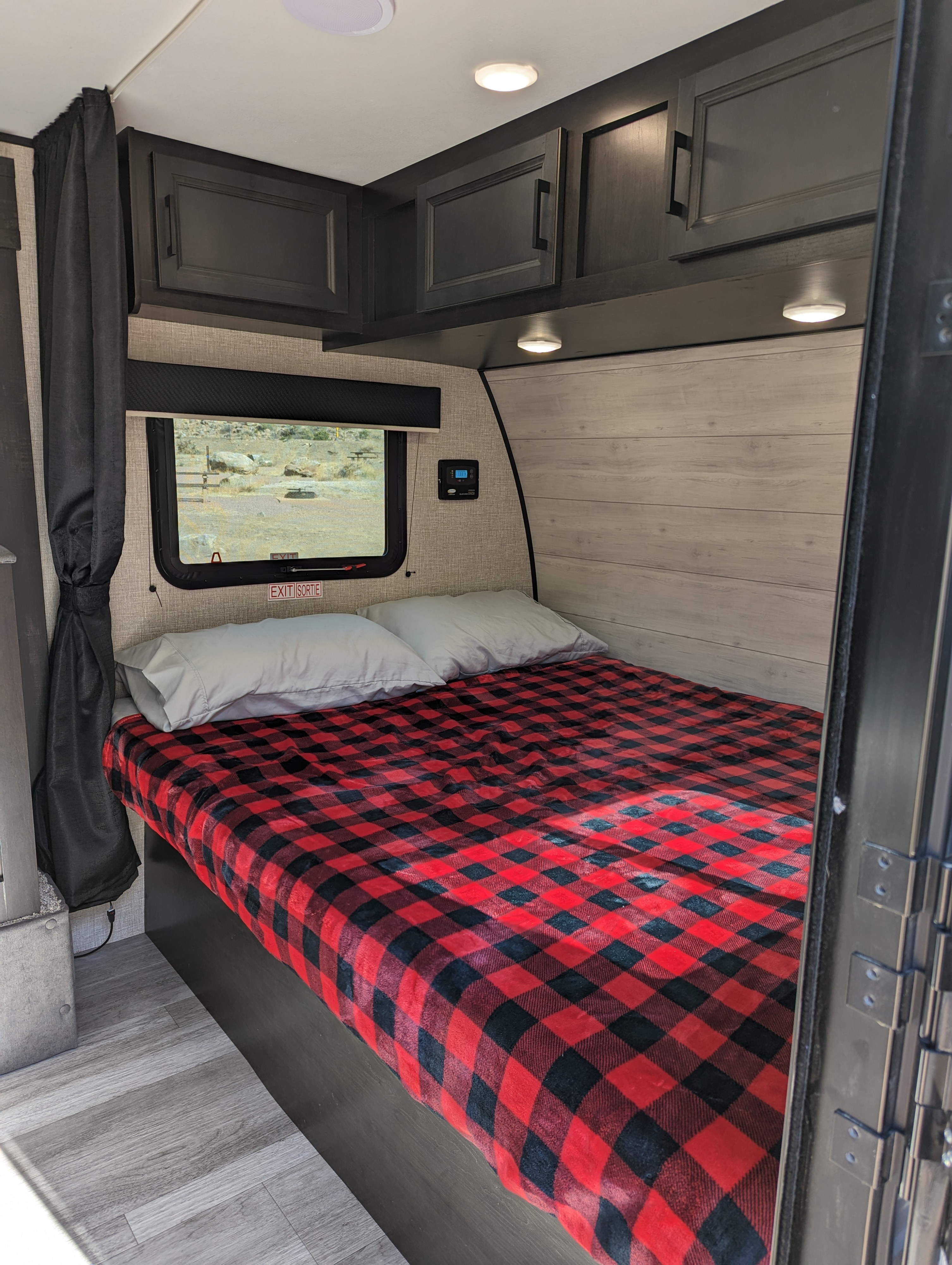 Great sized queen bed, with lots of storage [board games inside], outlets, and a privacy curtain. Plus a touch it and leave it solar control. . Jayco Baja SLX 184BS 2023