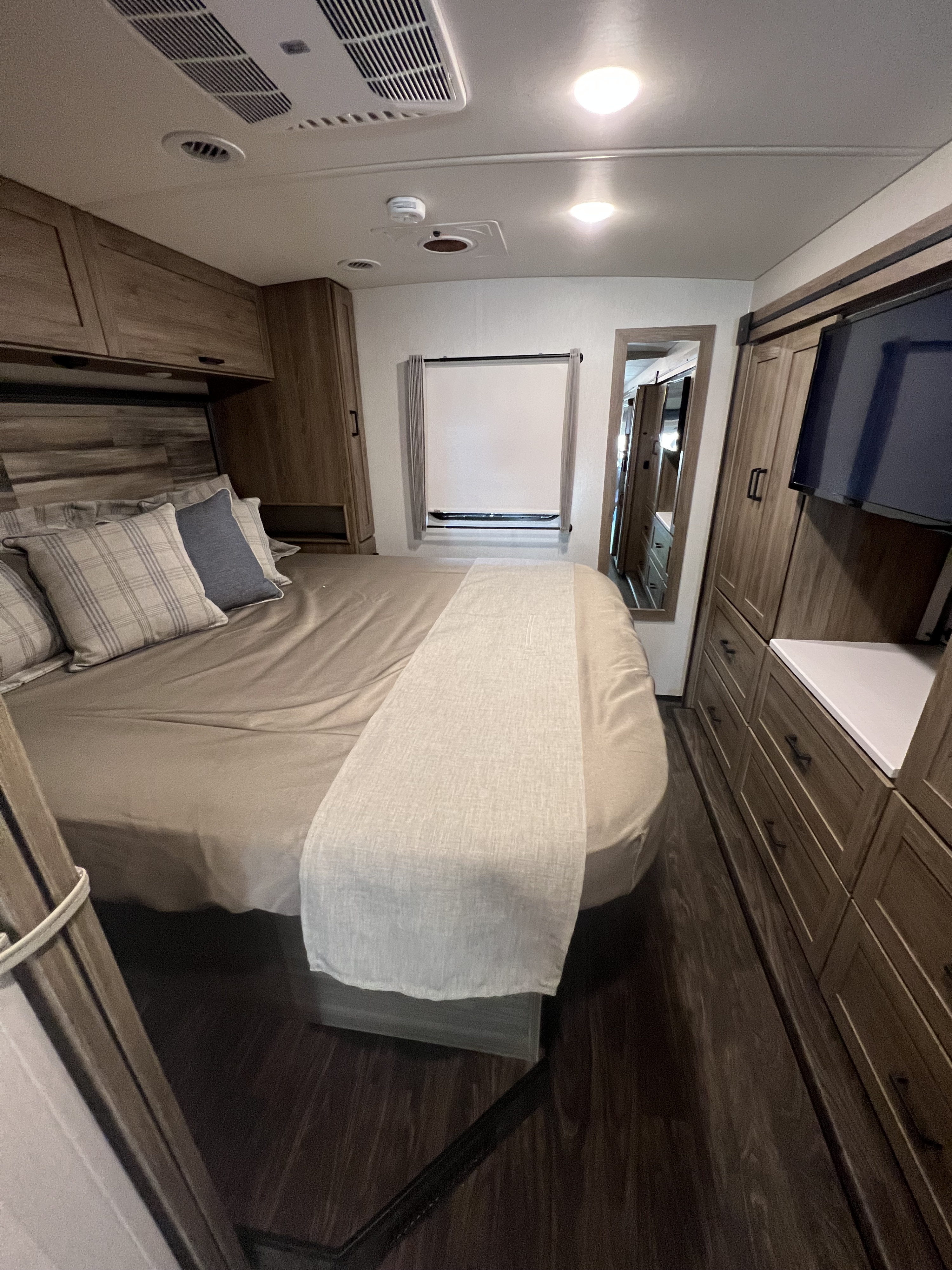 Master bedroom with lots of storage space. Winnebago Vista 2023