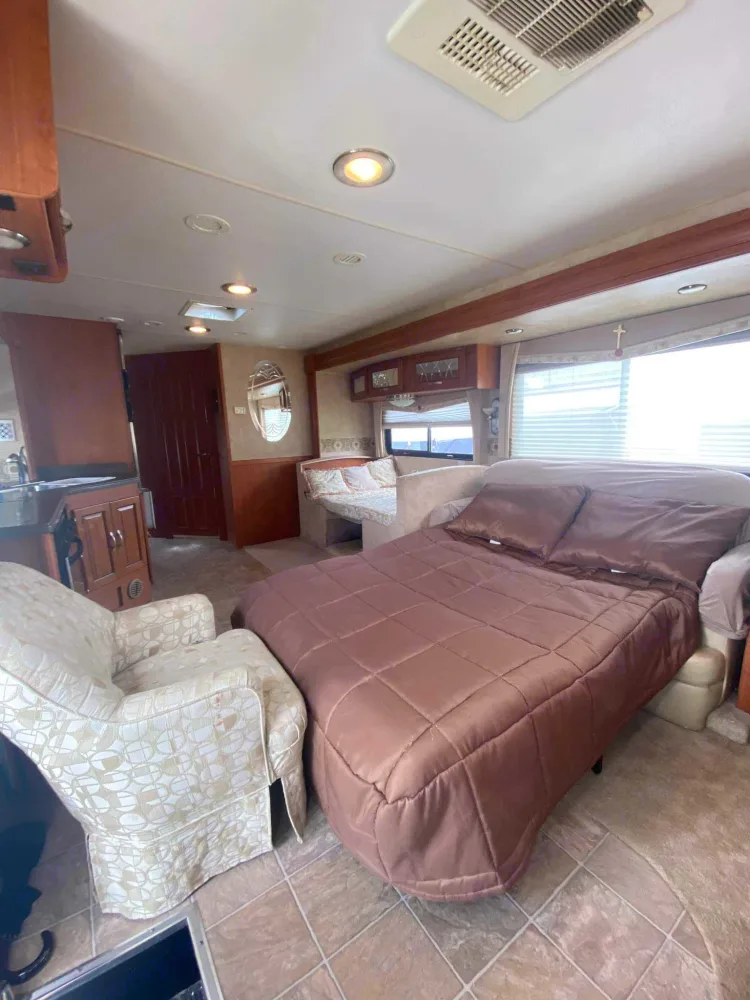 When living room is setup for sleeping there's still plenty of room in front of the kitchen/dining area and don't forget there's 2 private bedrooms.. Georgetown M-379 2009