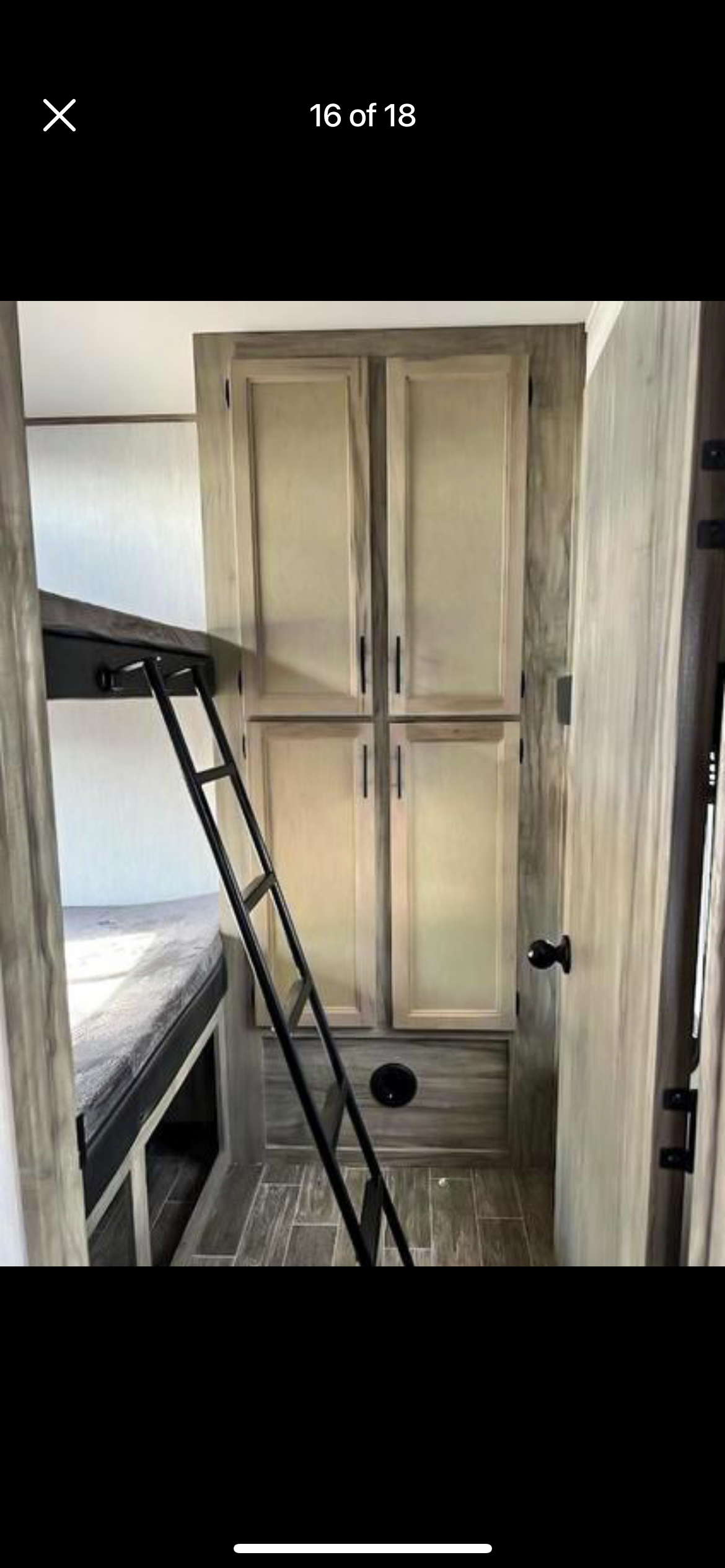 RV rental: Compact interior with bunk beds, ladder, and ample storage cabinets. Features durable flooring.. Forest River Cherokee Arctic Wolf 2021