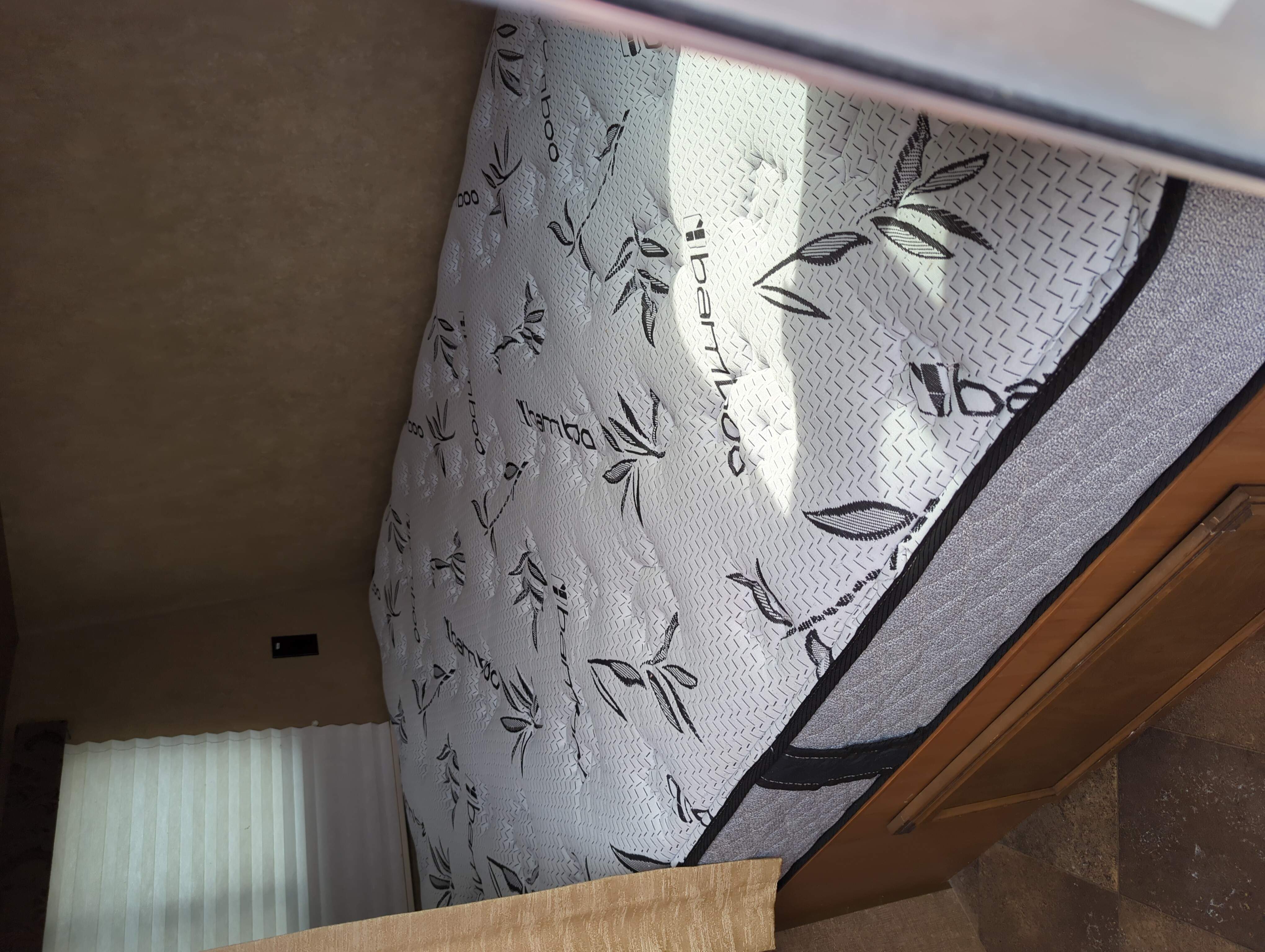 Cozy RV rental bedroom featuring a clean bamboo mattress with leaf patterns, ensuring a comfortable stay.. Starcraft AR-One 2014