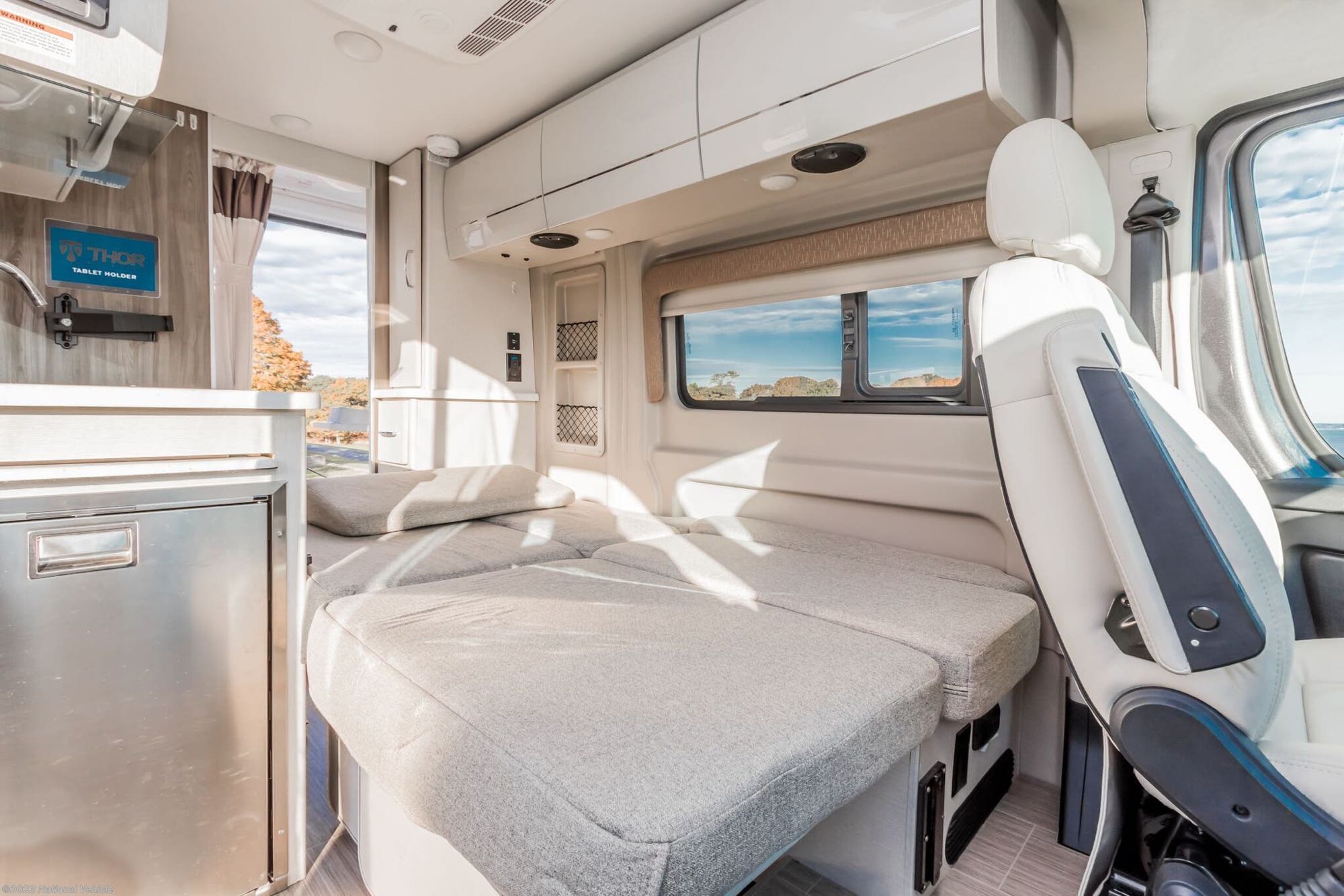 Sofa converts to two person bed.  you can still get to refrigerator and bathroom.  Also lots of storage above.. Thor Rize 2022