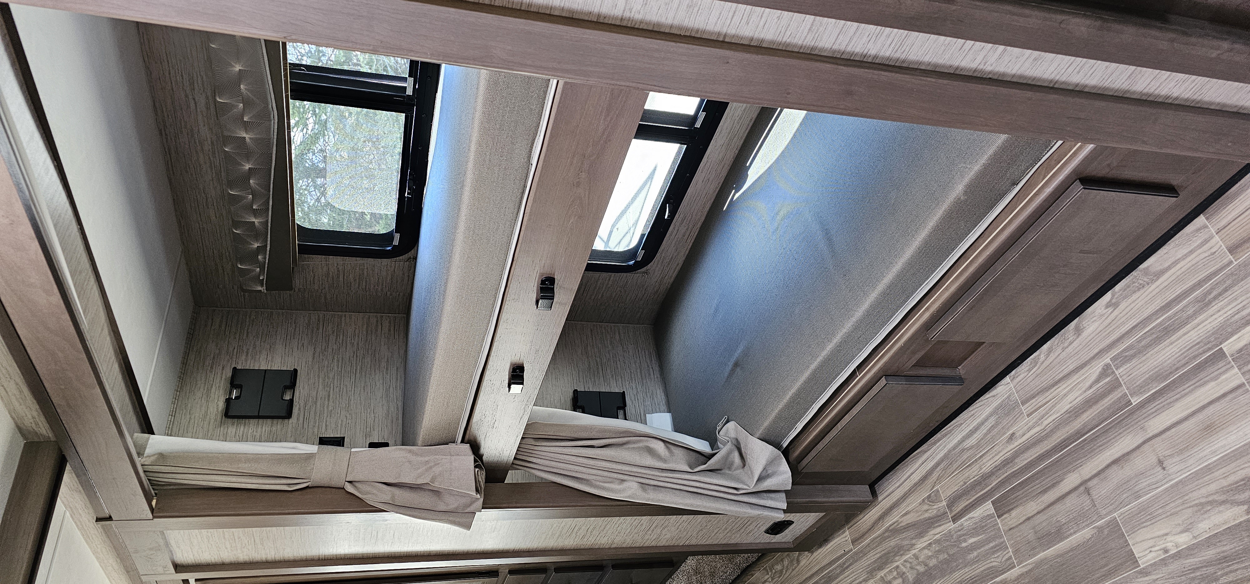 Inside an RV rental: upper and lower bunk beds with windows and privacy blinds, ideal for travel.. Thor A.C.E. 2022