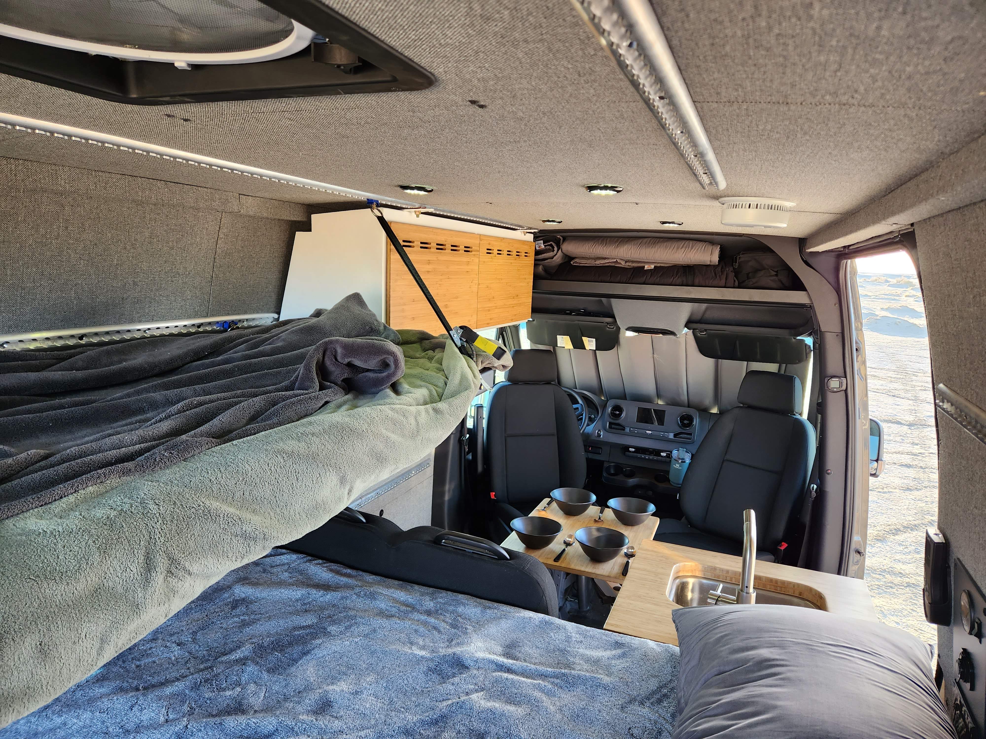 a view from the main bed into the front of the van. Mercedes Sprinter 2020